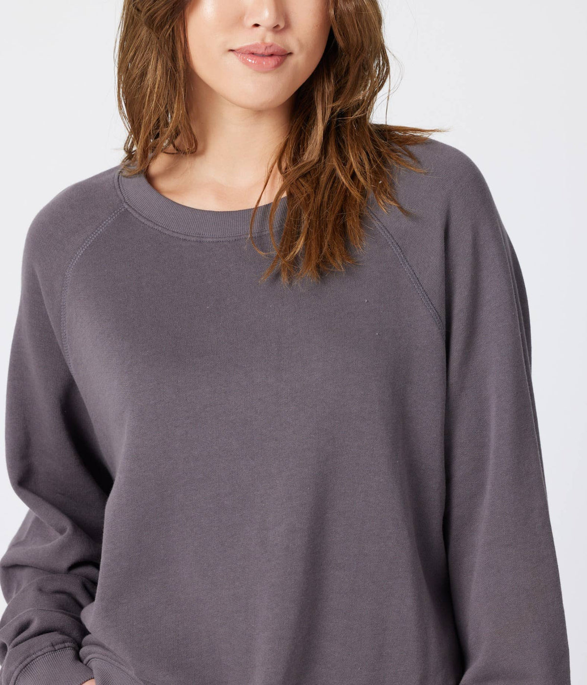 Organic cotton raglan fleece sweatshirt by Known Supply, showing beige and navy color blocking, long sleeves, and cozy fabric.