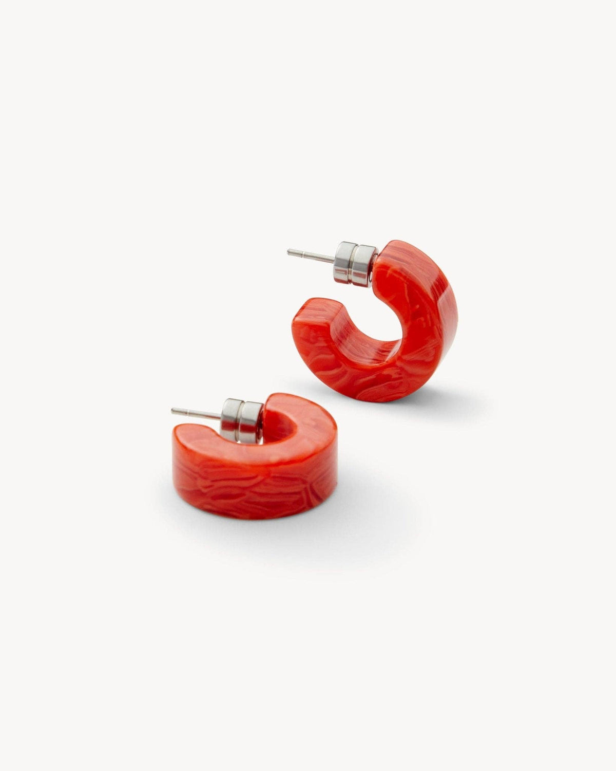 MACHETE Muse Hoops in Poppy, vibrant orange hoop earrings with a sleek, modern design, showcased on a neutral background.