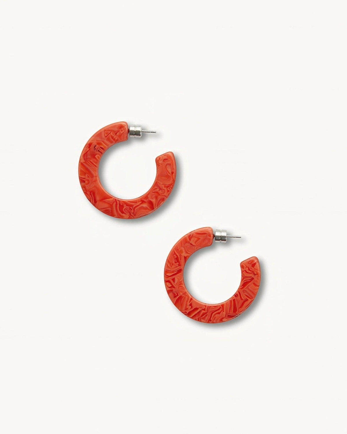 MACHETE Kate Hoops in Poppy with bold red-orange circular earrings on a white background.