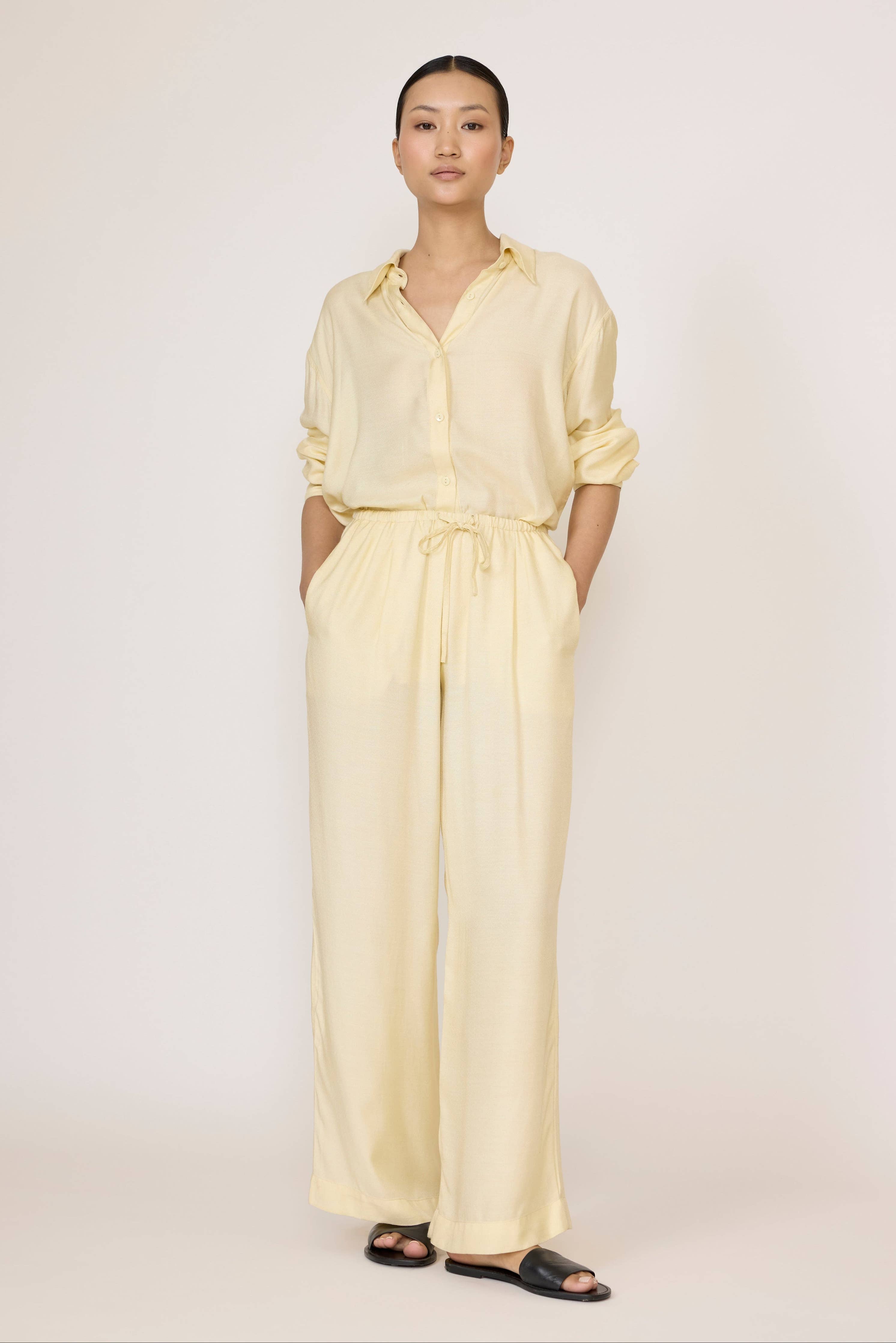 LAUDE Easy Pant in Butter, soft casual wide-leg trousers with relaxed fit and smooth fabric, shown in a neutral color.