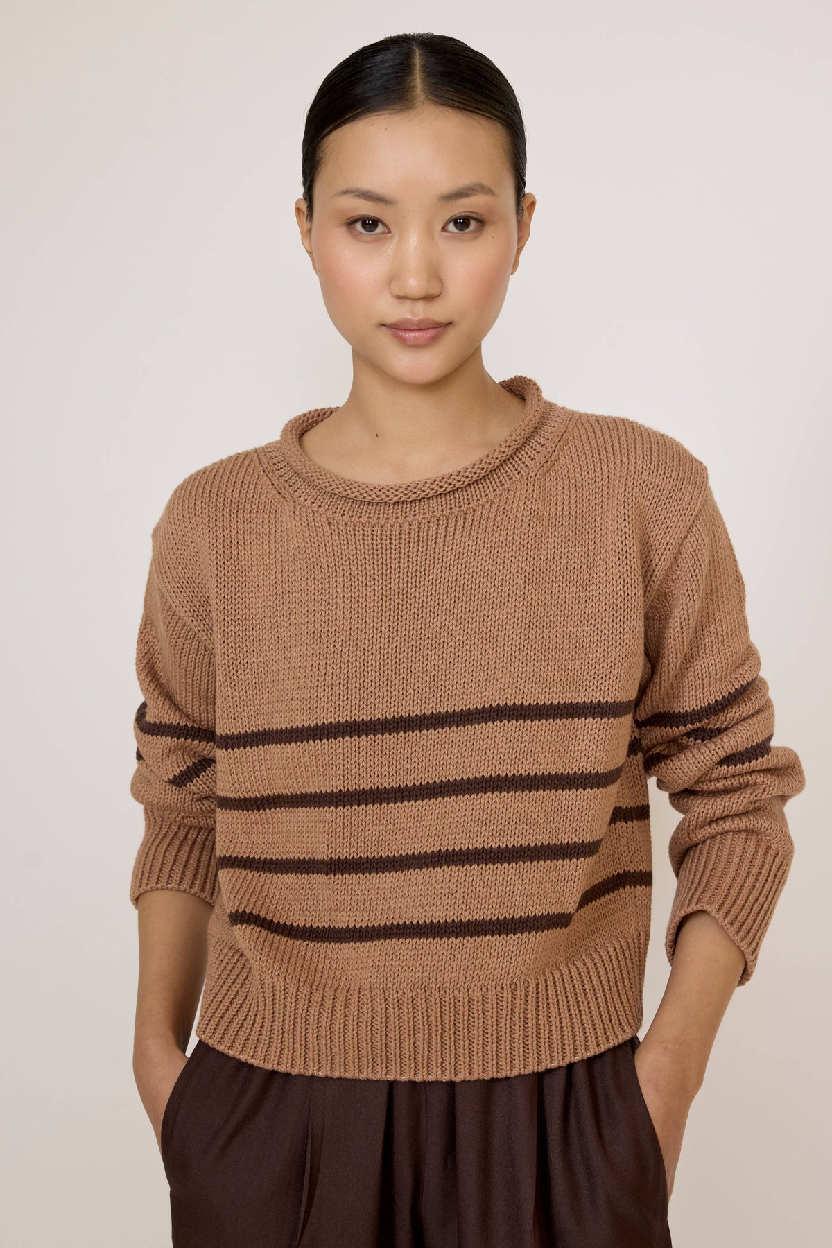 LAUDE Field Sweater with acorn stripe pattern, featuring a cozy knit design and ribbed cuffs on a neutral background.