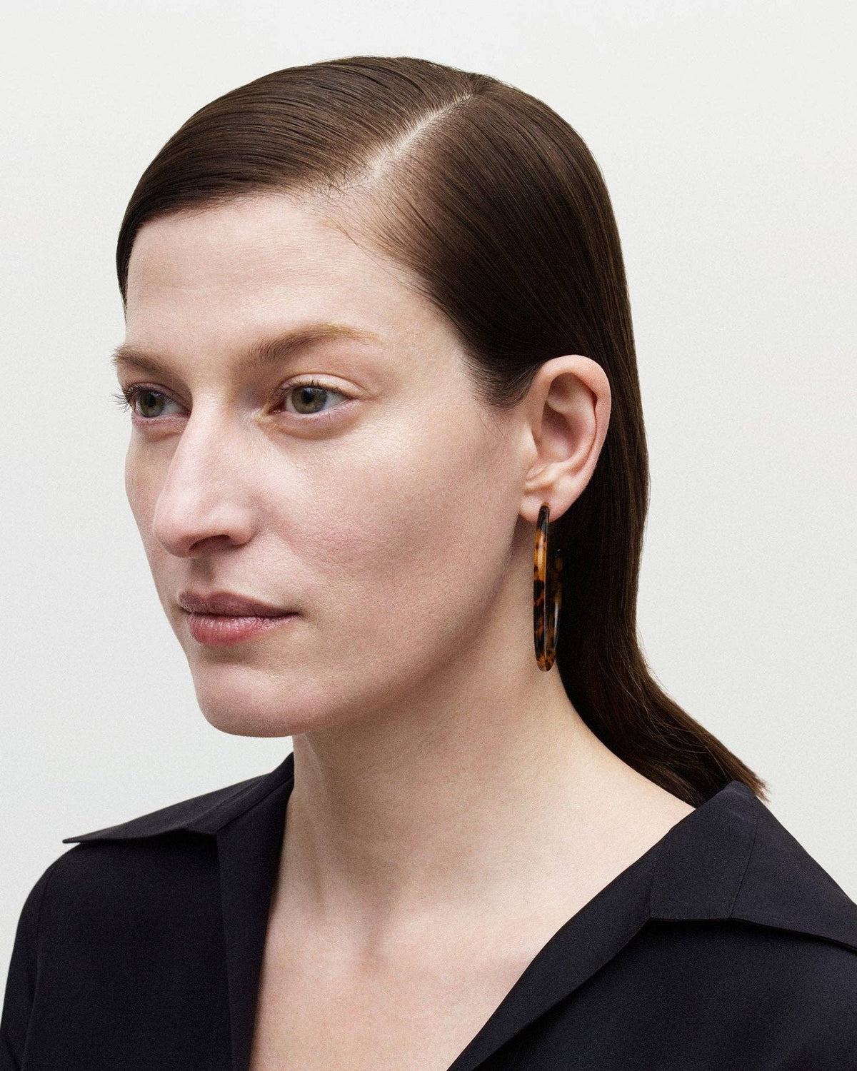 Large Poppy hoops by MACHETE featuring bold, round gold-tone earrings with a smooth finish and spacious hoop design.