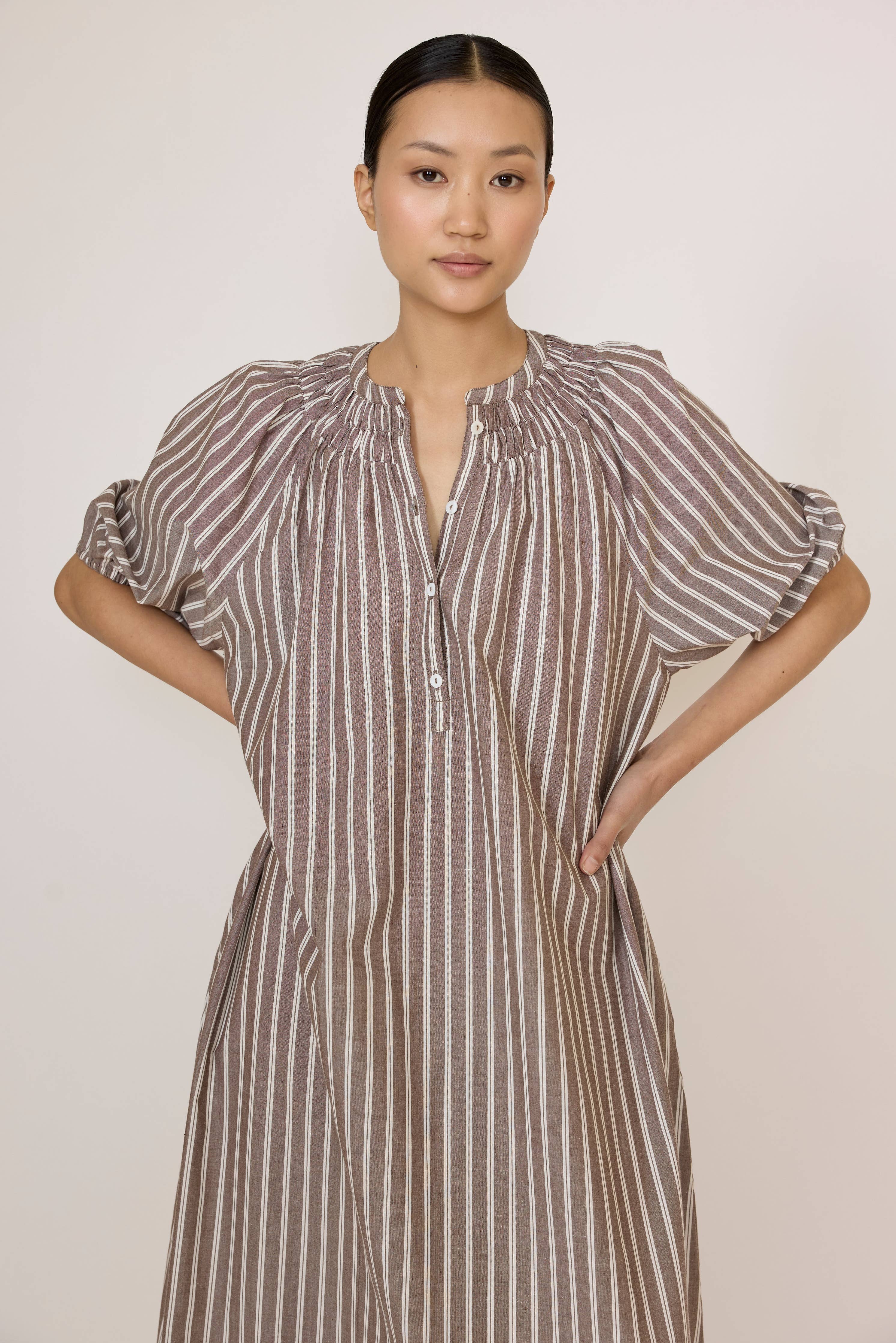 LAUDE popover tunic dress in acorn stripe with relaxed fit, long sleeves, and casual style, shown on a model.