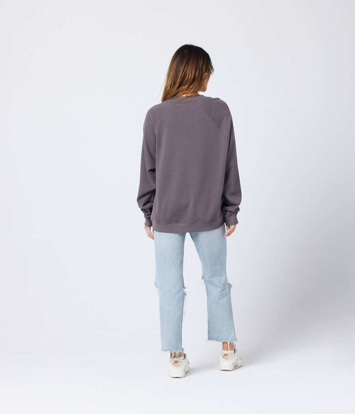 Organic cotton Raglan fleece sweatshirt by Known Supply, showing the cozy, long-sleeve top with contrasting color sleeves.