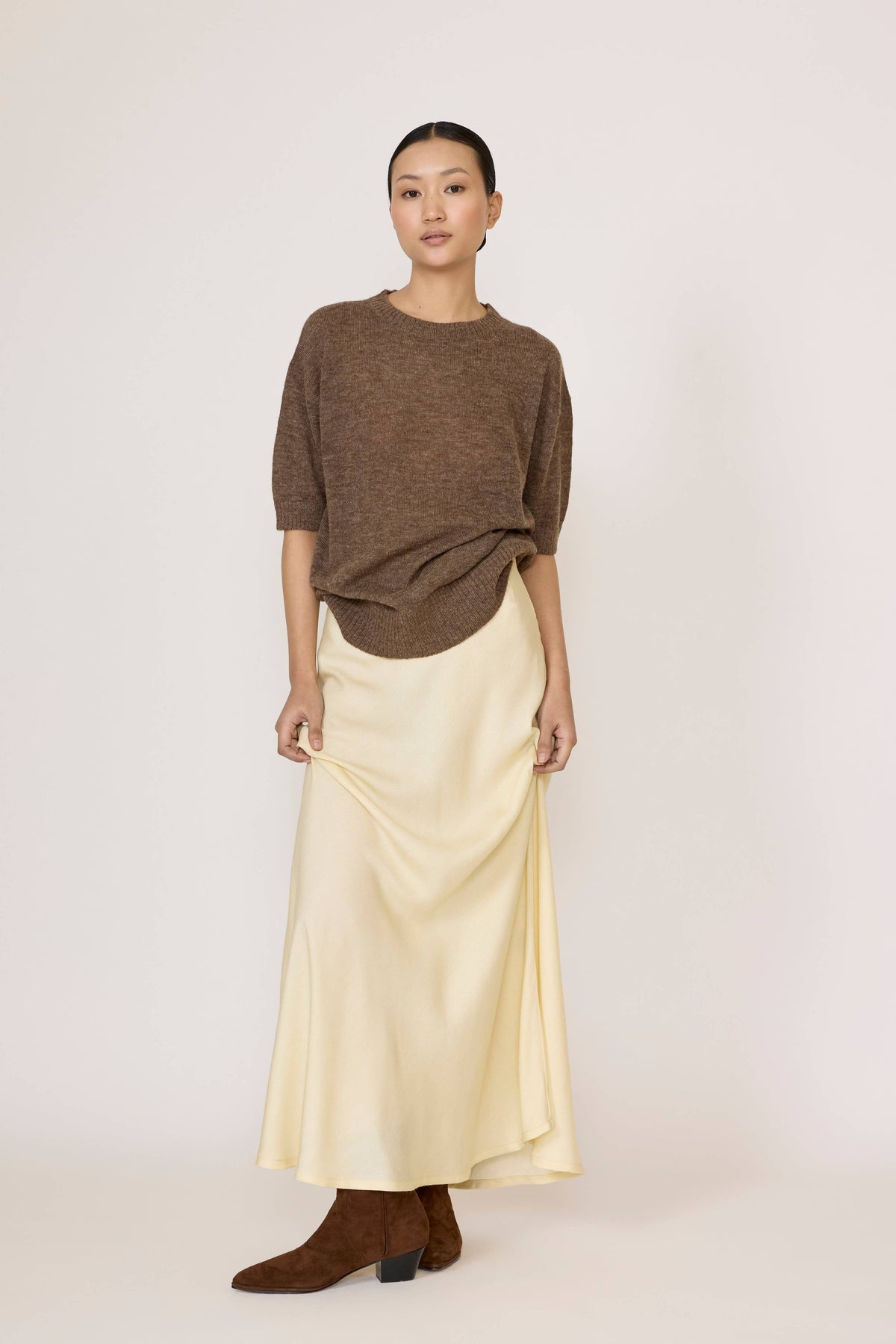 LAUDE bias maxi skirt in buttery fabric, flowing design, with a high waist and elegant drape, perfect for a sophisticated look.