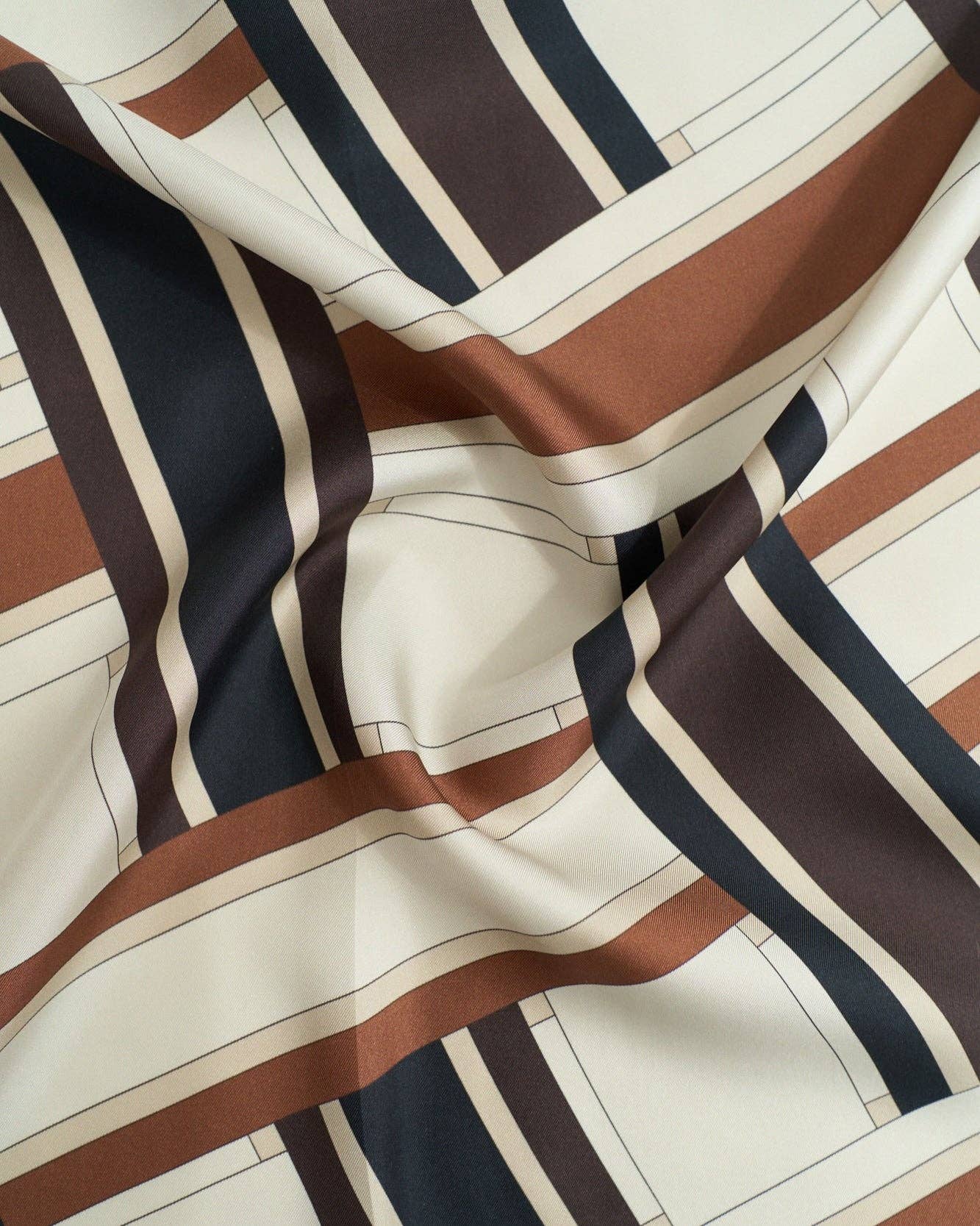Lost Pattern NYC Leatherology silk square scarf in neutral tones, featuring a stylish pattern and lightweight, smooth fabric.