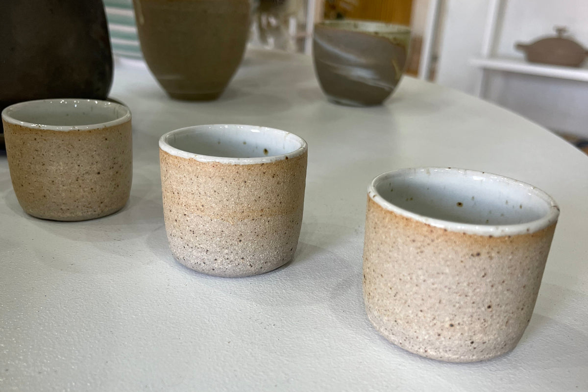 Handmade speckled ceramic match striker for candles from Sage Valley, designed for easy lighting of votive candles.