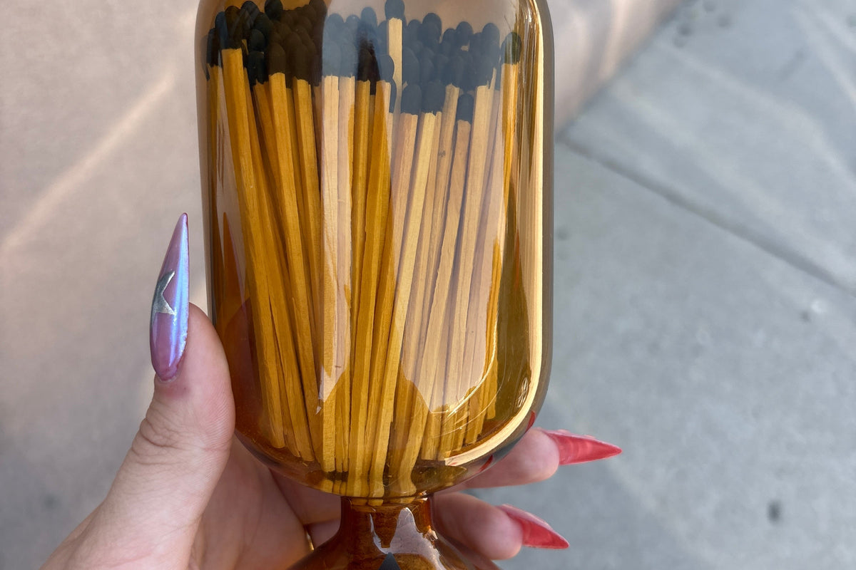 SKEEM glass match cloche with matches inside, elegant clear glass cover for candle and match display, decorative and functional.