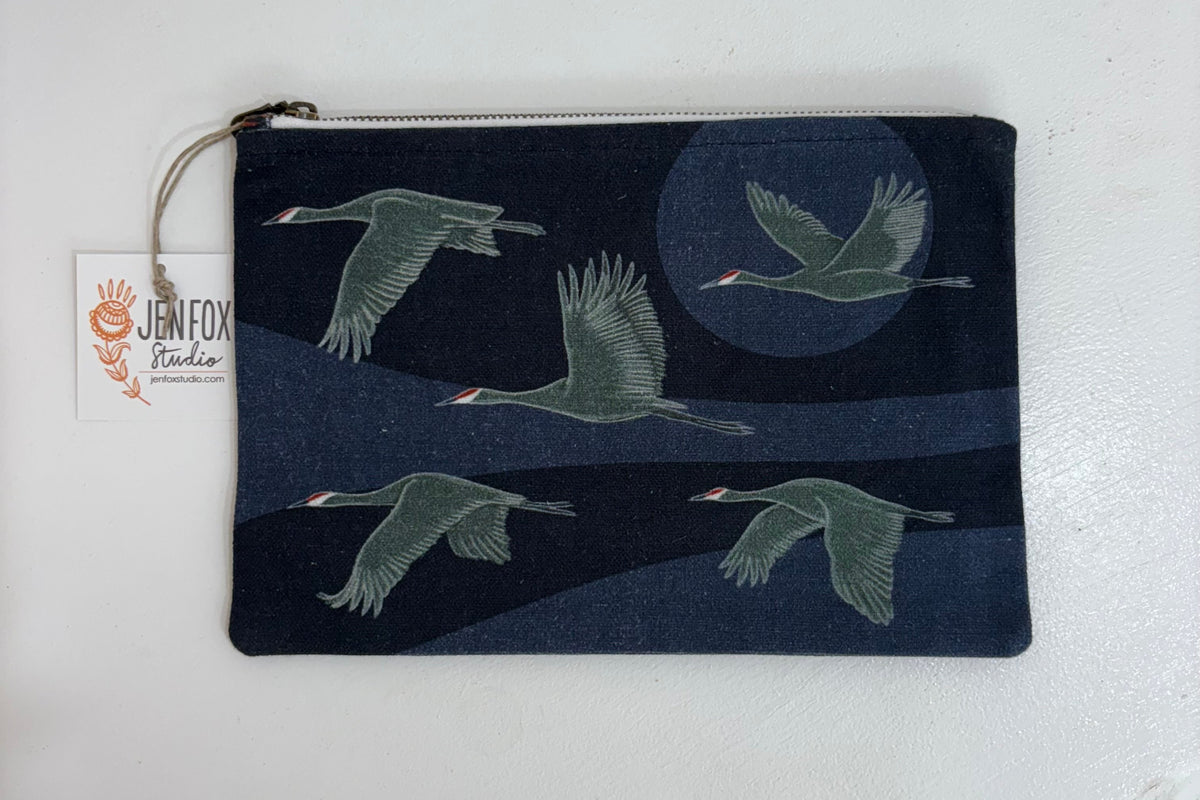 Jen Fox Studio Cranes and desert botanical canvas zip pouch, stylish accessories bag with nature-inspired design and vibrant colors.