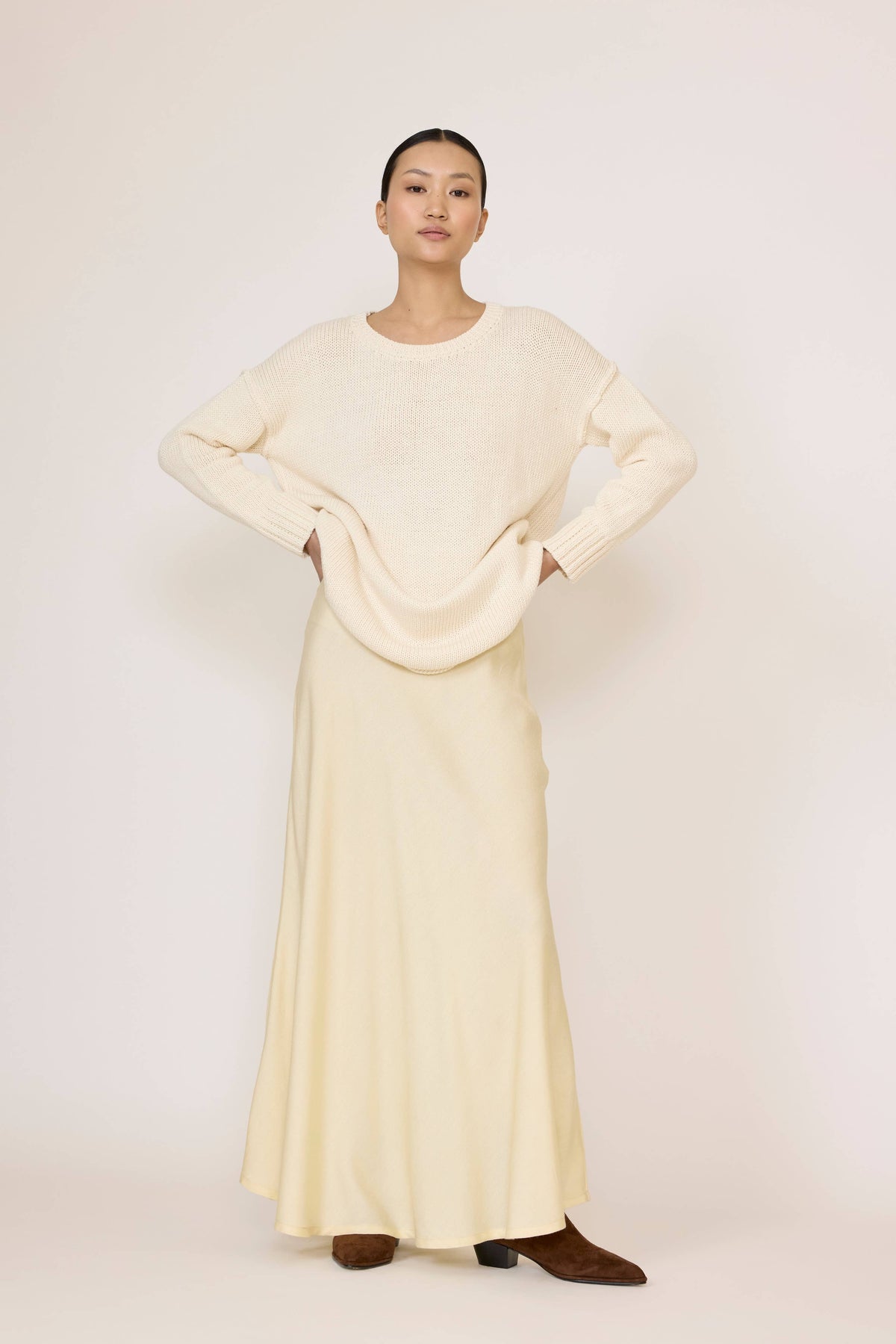 Bias-cut maxi skirt by Butter from Laude the Label, flowing fabric with elegant drape, in a neutral color.