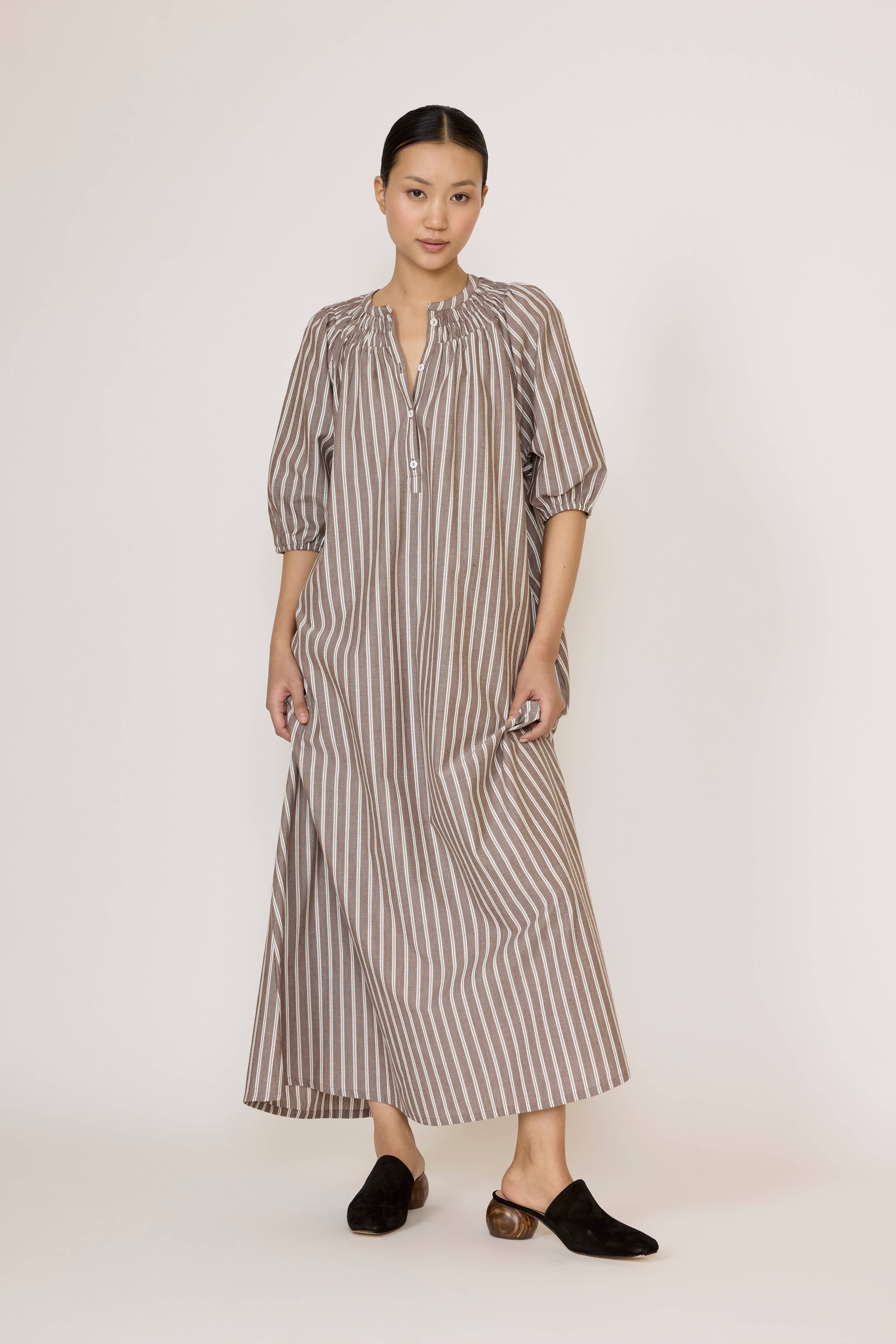 LAUDE popover tunic dress in acorn stripe with long sleeves and relaxed fit, displayed on a hanger.