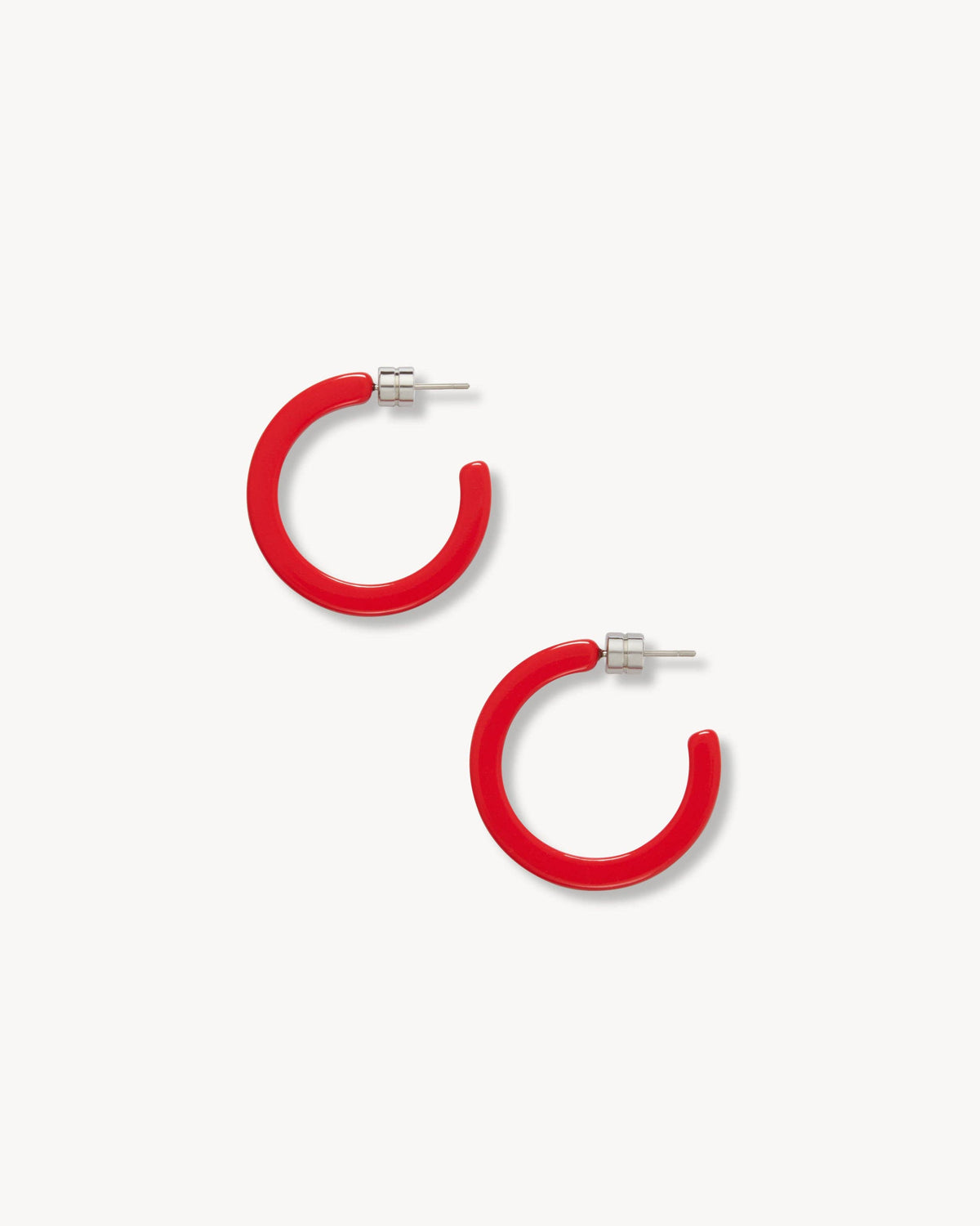 MACHETE Mini Ruby Hoops earrings featuring small, vibrant ruby-colored gemstone hoops on a silver setting.