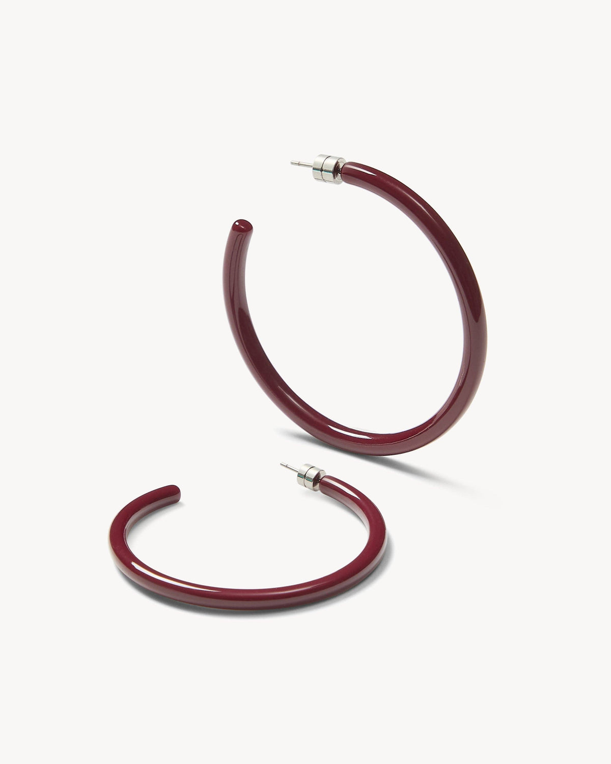 Large oxblood hoops earrings by MACHETE with a bold, circular design perfect for stylish accessories.