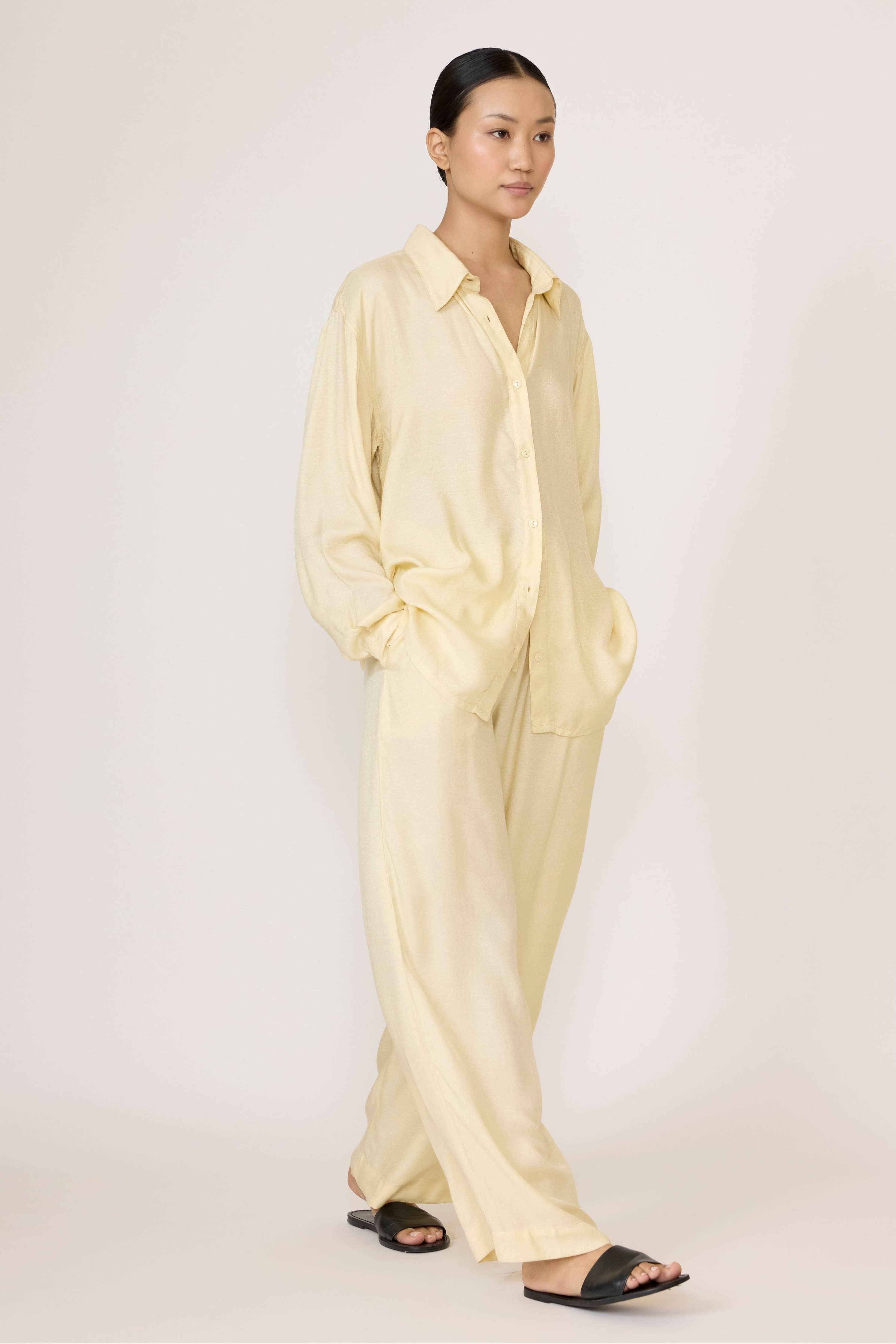 Light beige Easy Pant by LAUDE, featuring a relaxed fit and soft fabric, displayed on a hanger against a neutral background.