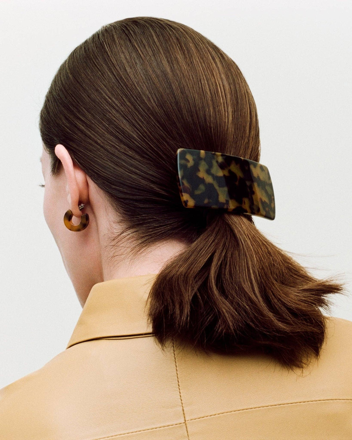 MACHETE Muse Hoops in Poppy featuring bold orange-red resin hoops with gold-tone accents on a white background.