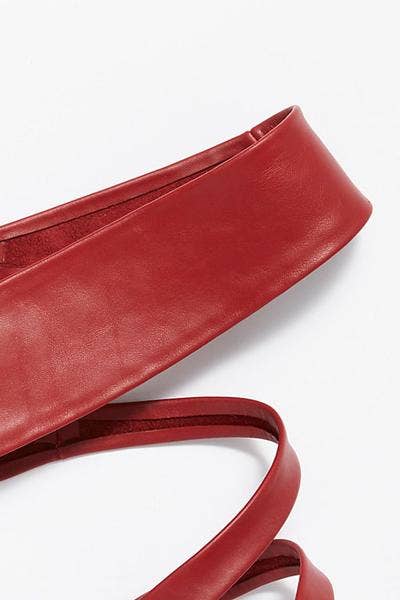Red adjustable Wrap Leather Belt from ADA Collection Belts, featuring a stylish design and secure buckle detail.