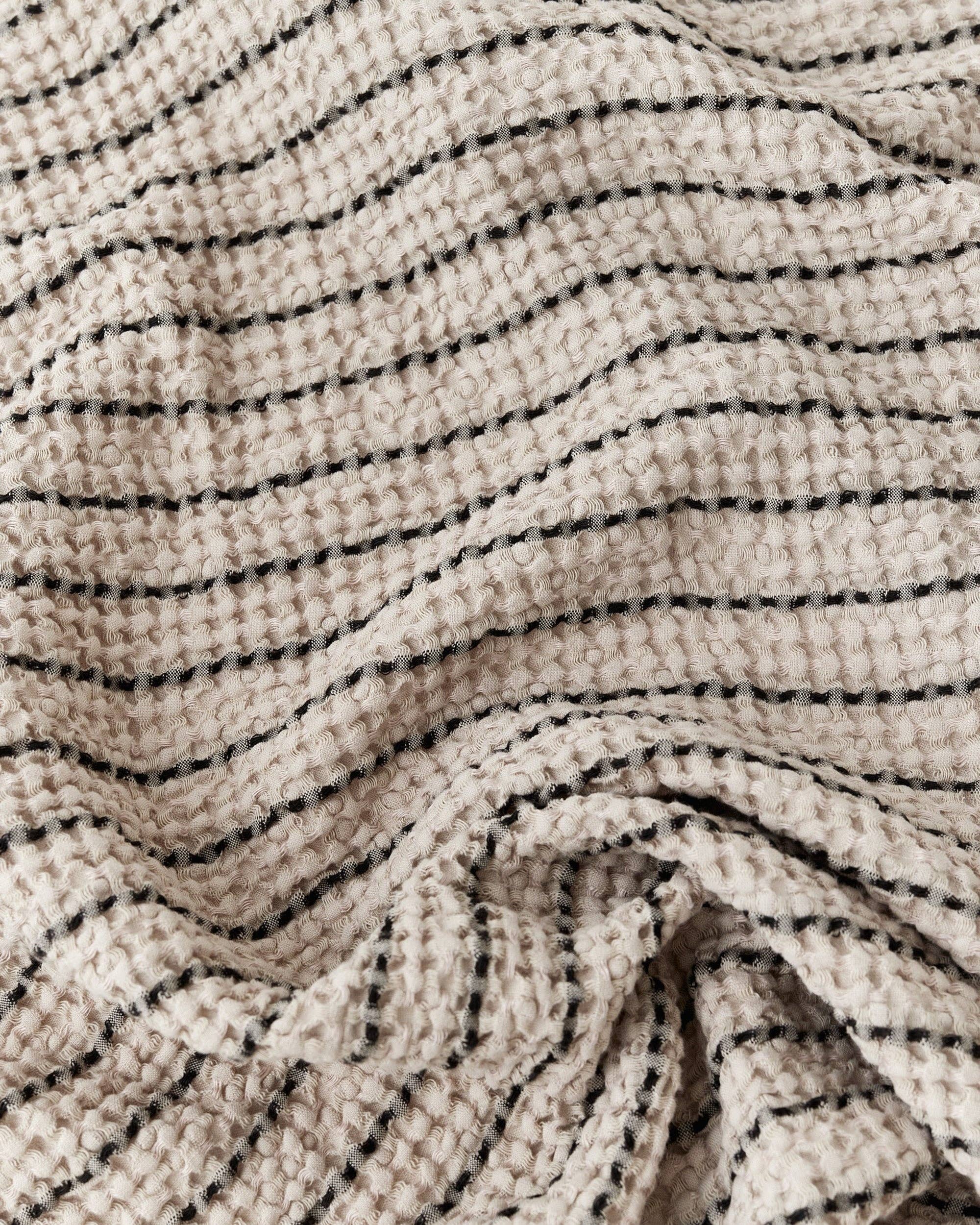 Waffle face towel in Stripes