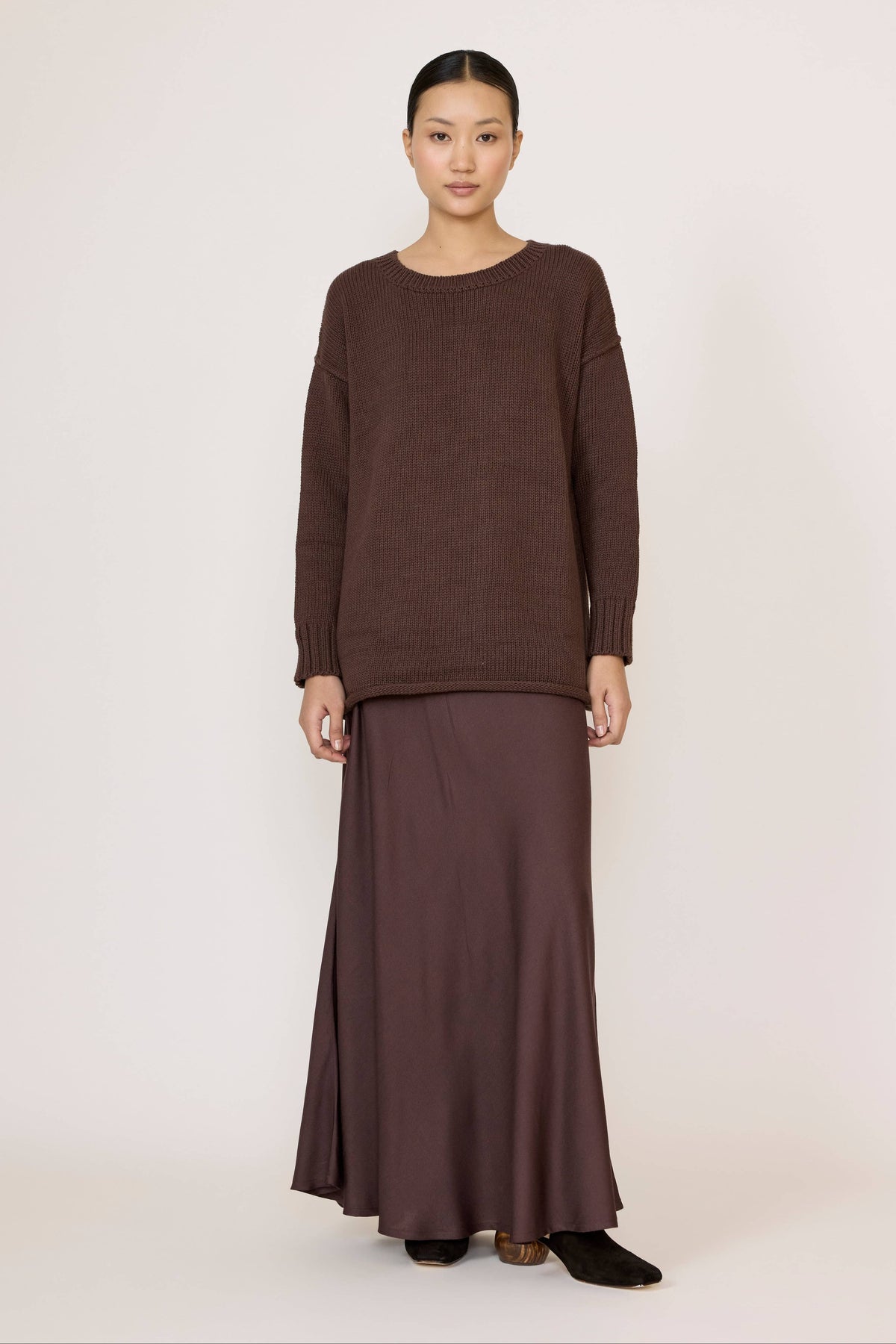 LAUDE oversized crewneck sweater in rich chocolate color, soft knit fabric, shown on a model.