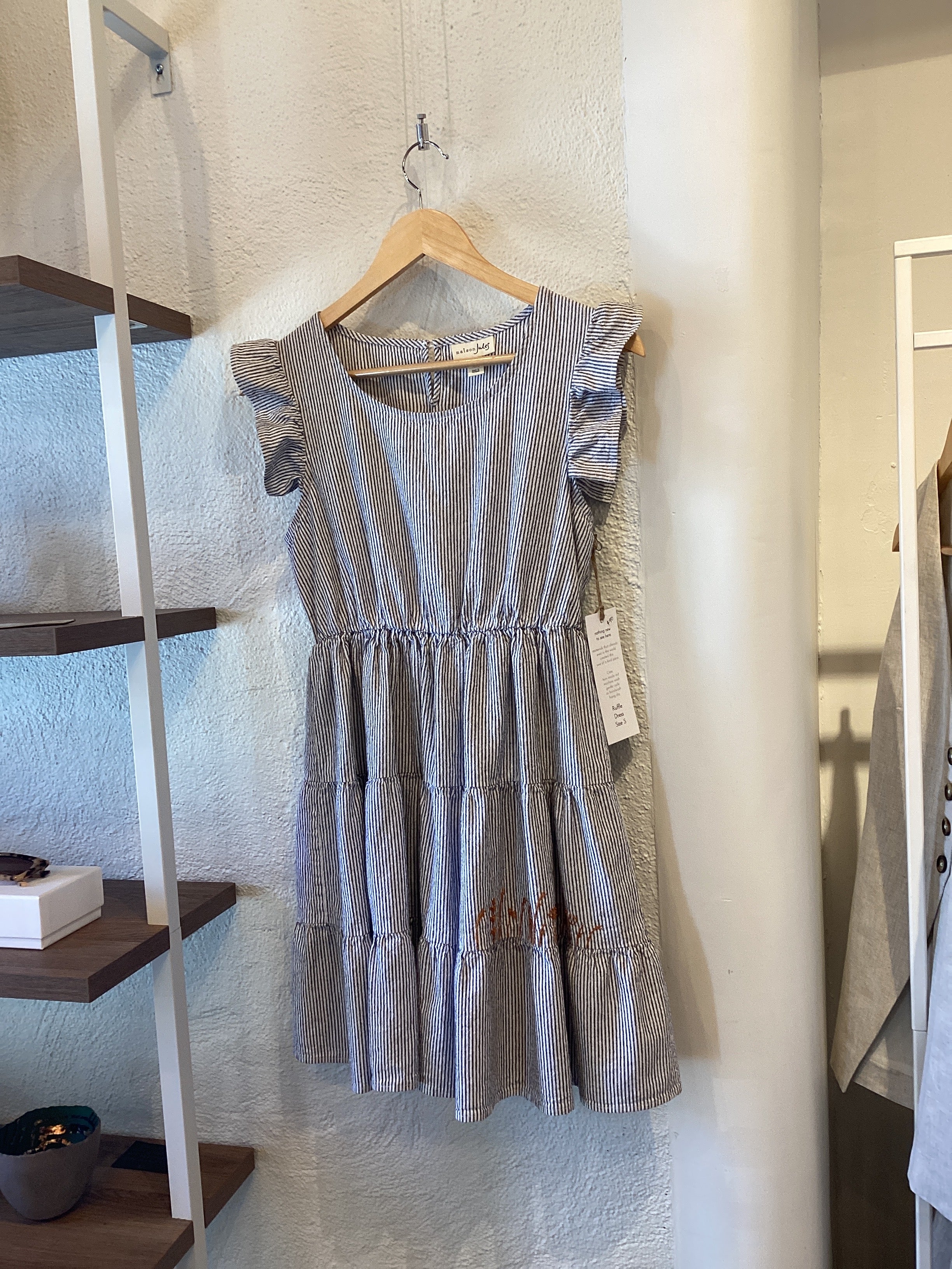 Scattered Light Ruffle Dress in size small by Scattered Light Stitchery, featuring a flowing silhouette with ruffle details.