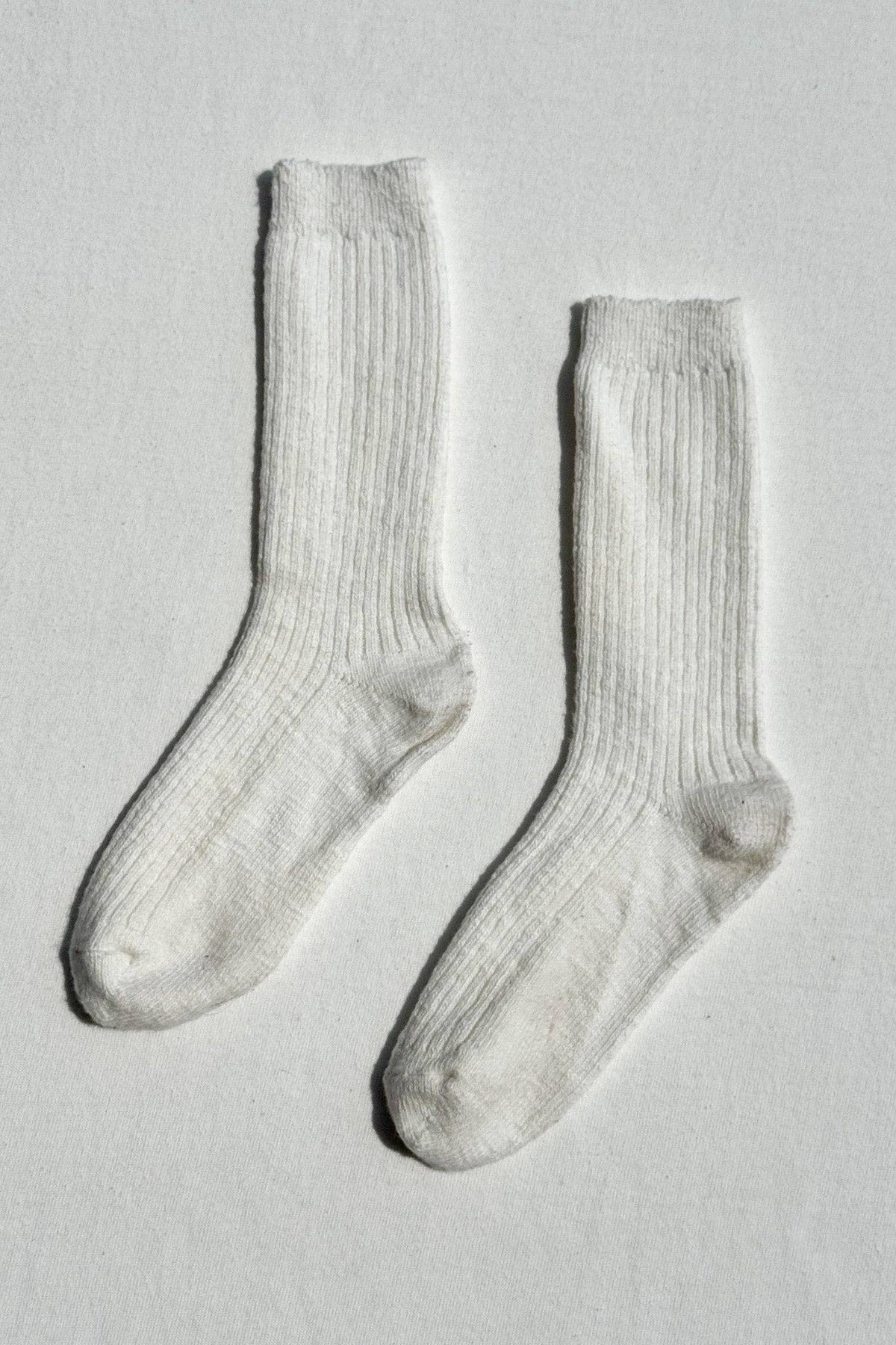 Close-up of cozy Cottage Socks by Le Bon Shoppe, showcasing soft knit texture and comfortable fit in natural setting.