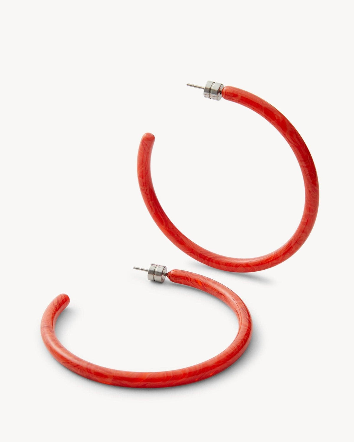 Large Poppy-colored hoops earrings by MACHETE, featuring bold, round metal design perfect for stylish accessories.