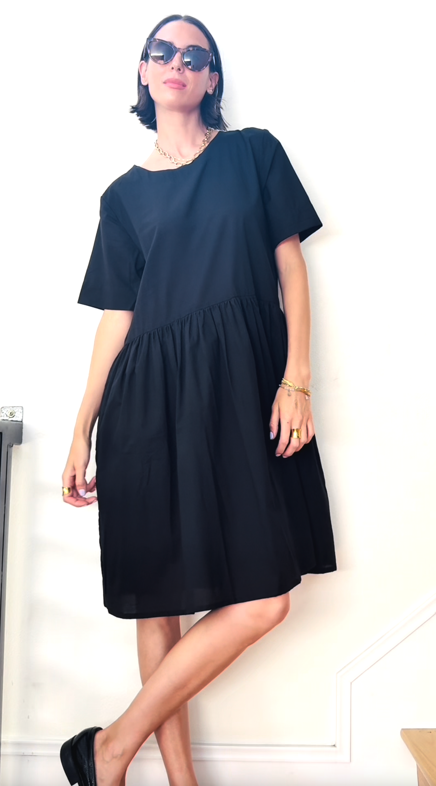 Black Hudson dress by and for Good, featuring a stylish silhouette with a fitted bodice and flowing skirt, perfect for elegant occasions.