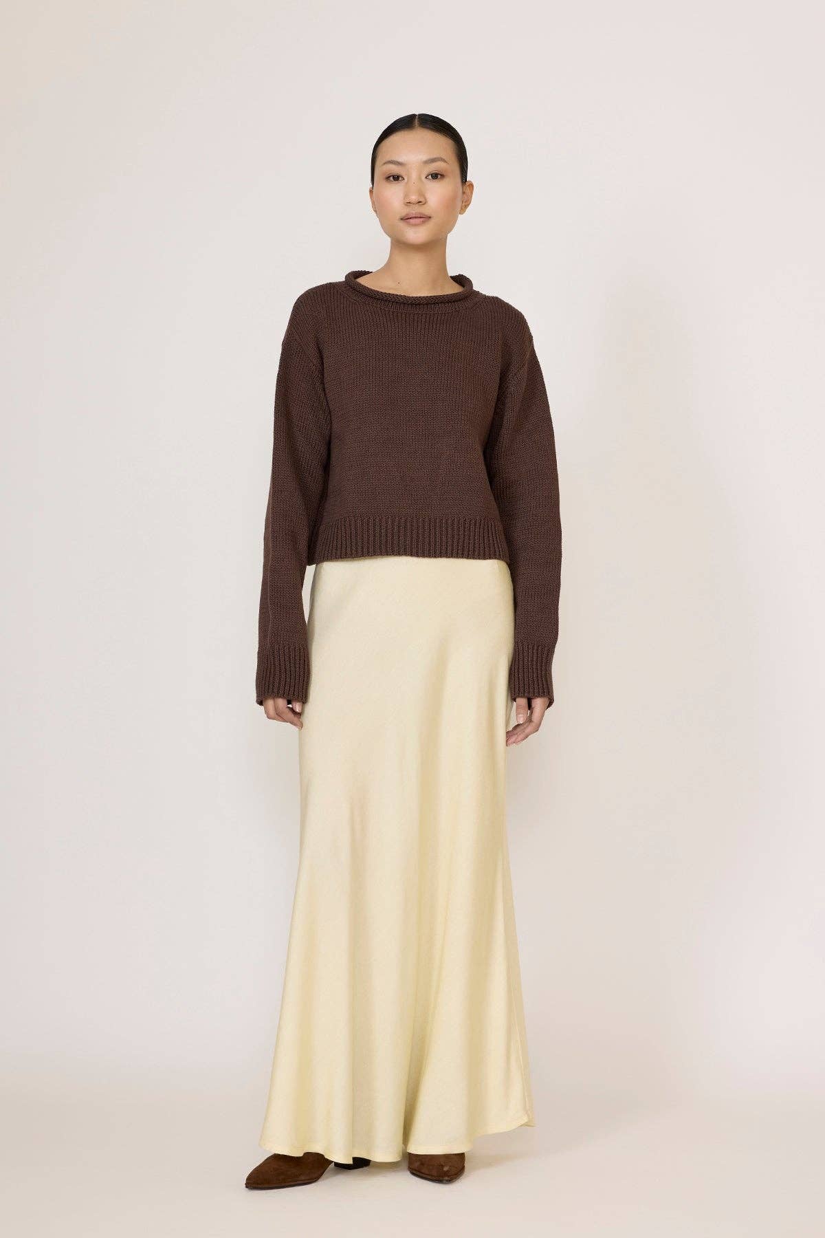 LAUDE Bias Maxi Skirt in butter fabric, featuring a flowing, elegant design with soft, smooth texture and a high waist fit.
