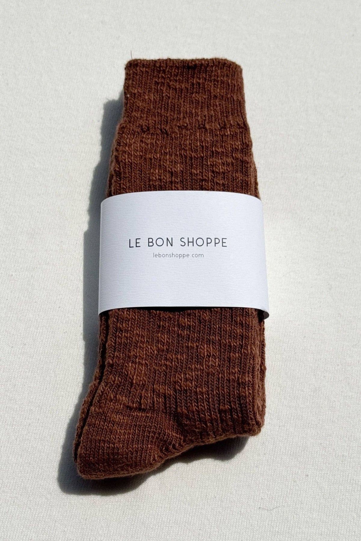Le Bon Shoppe Cottage Socks in soft, cozy fabric, featuring a striped pattern and ribbed cuffs for comfort.