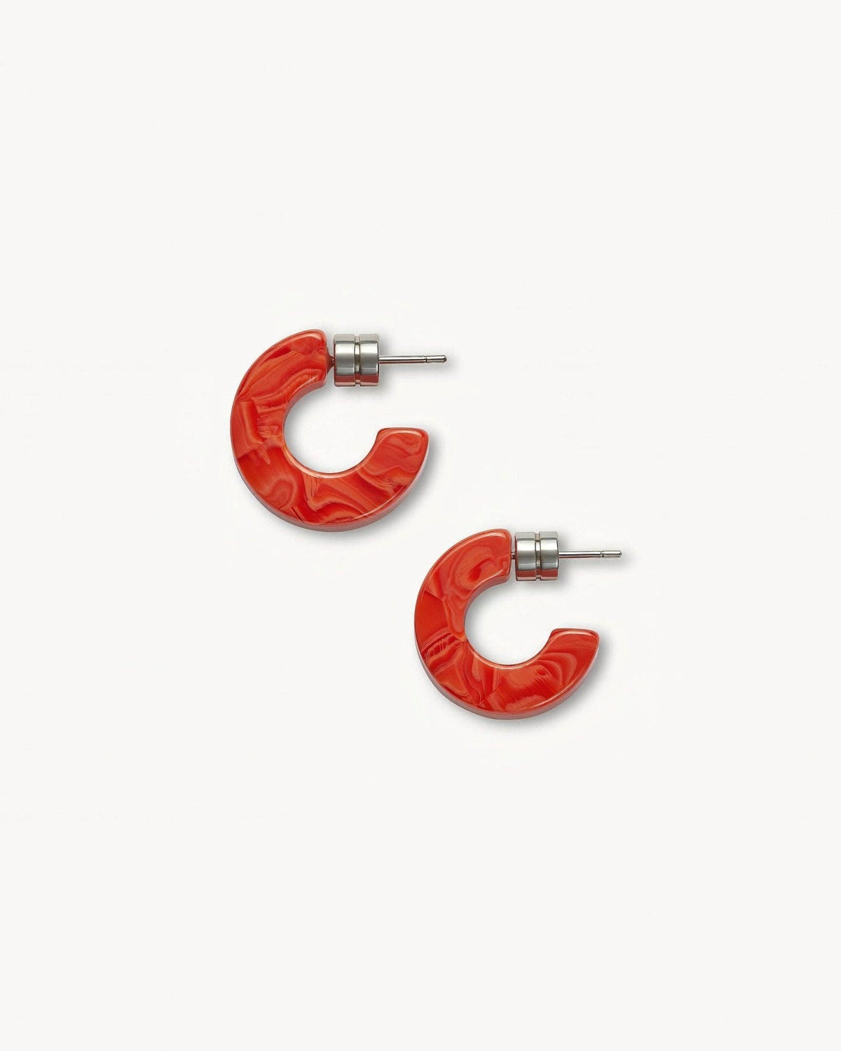 MACHETE Muse Hoops in Poppy with vibrant orange-red circular earrings and gold-tone details, worn as fashion jewelry.