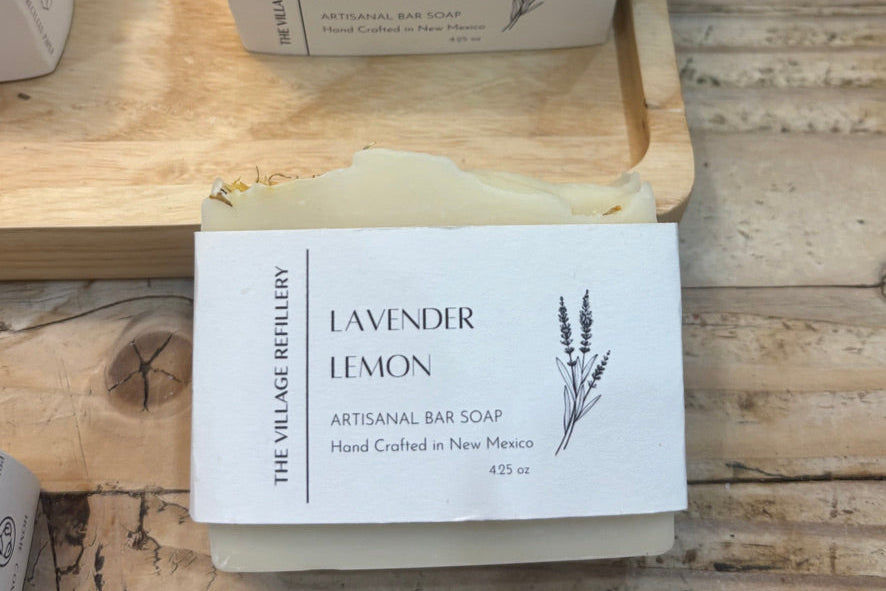 Lavender Lemon soap bar with packaging on a wooden surface