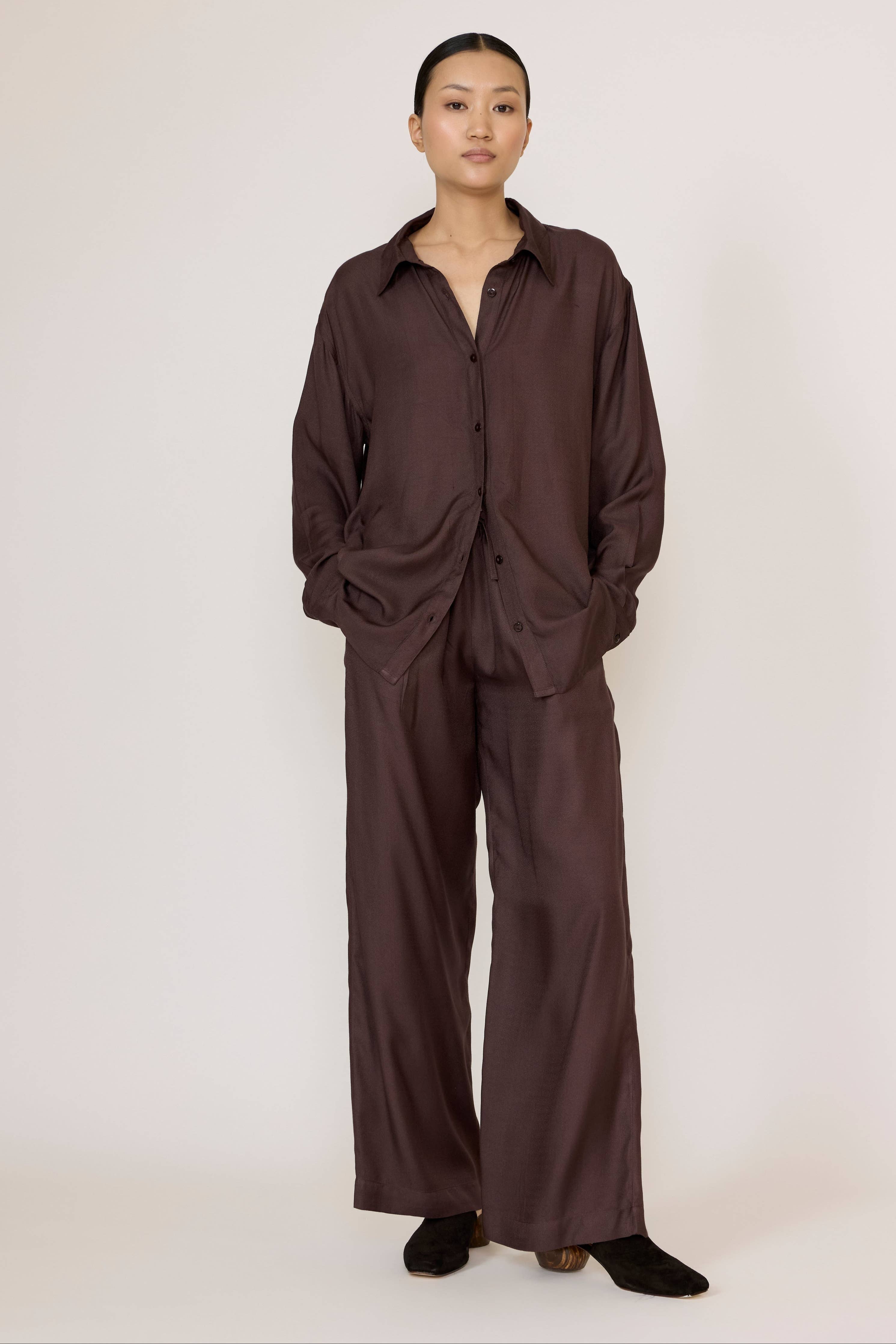LAUDE Everything Shirt in chocolate brown, casual long-sleeve shirt made from soft fabric, displayed on a hanger.