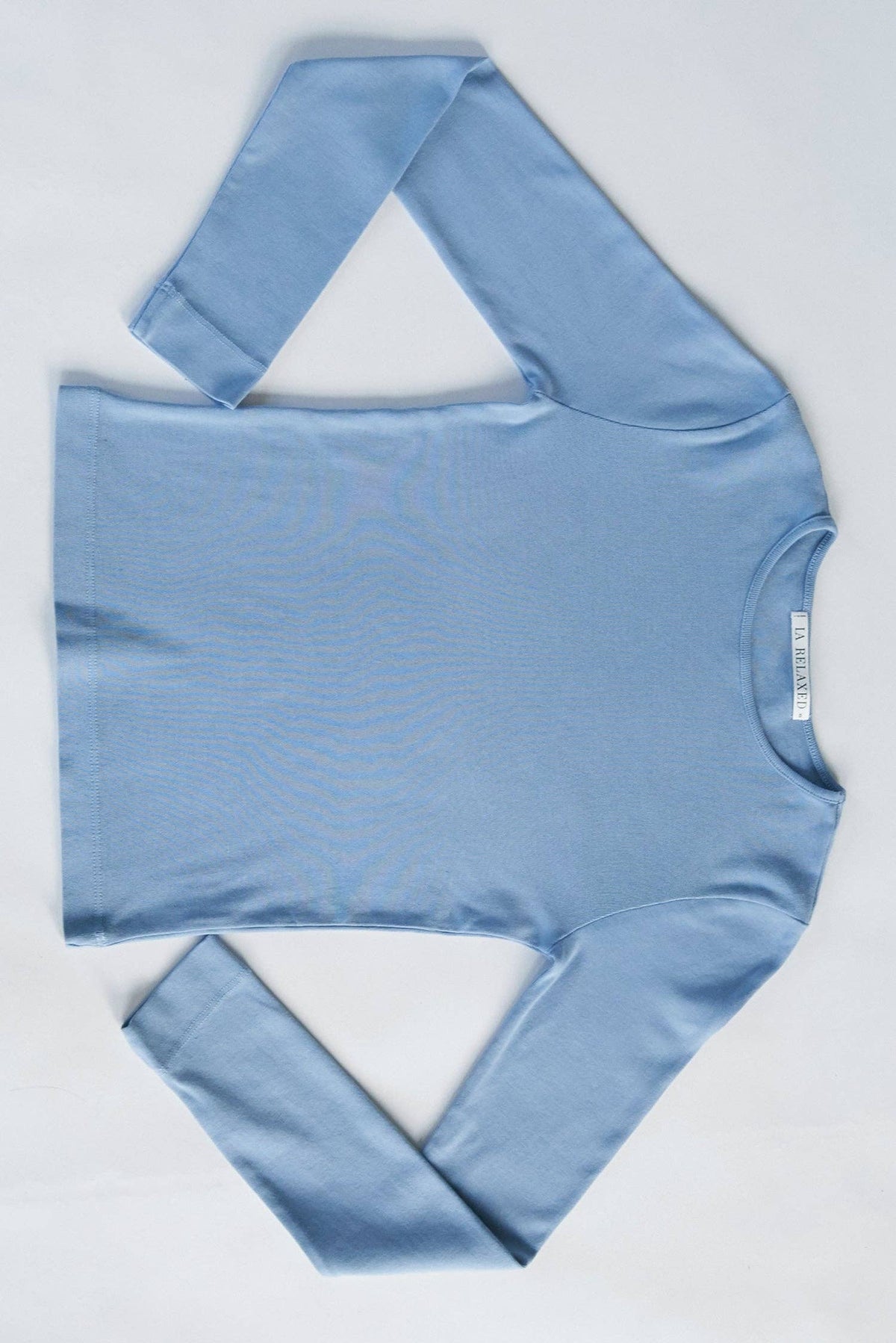 Organic long sleeve baby shirt by LA RELAXED, soft fabric with a comfortable fit, shown in natural light.