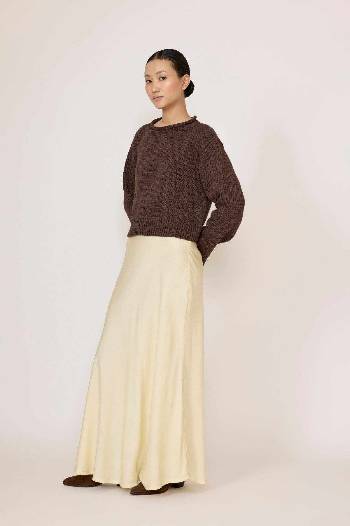LAUDE Bias Maxi Skirt in Butter fabric, flowing design with a high waist and elegant drape, perfect for stylish summer wear.