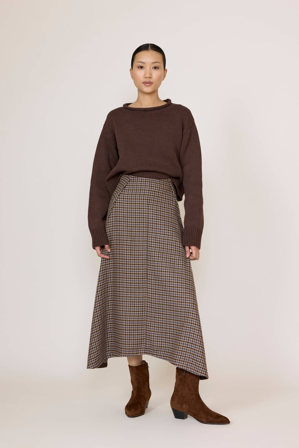 LAUDE wool plaid flowy midi skirt with pleats, showcasing a stylish, lightweight design perfect for casual or formal wear.