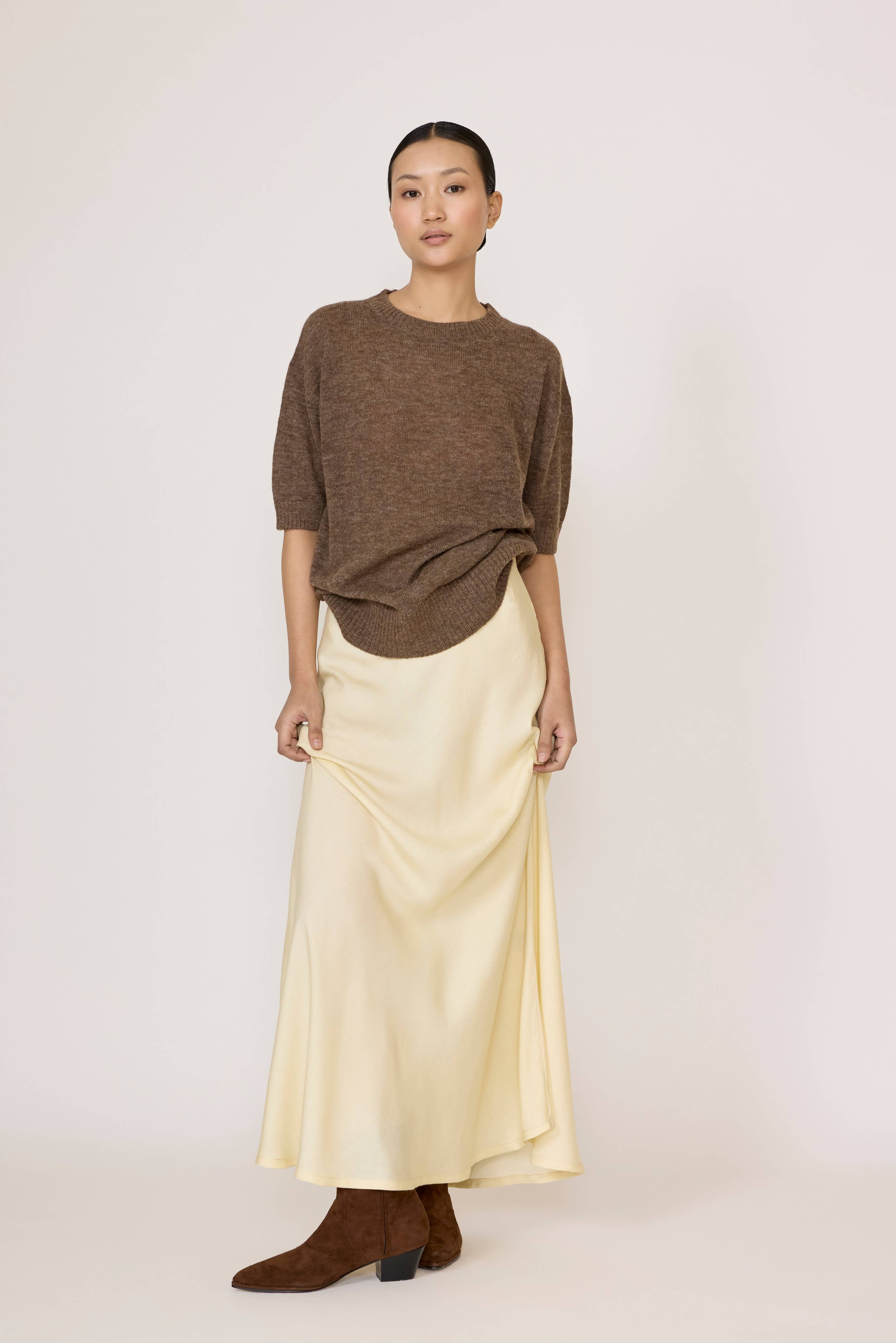 LAUDE bias maxi skirt in buttery fabric, flowing design, with a high waist and elegant drape, perfect for a sophisticated look.