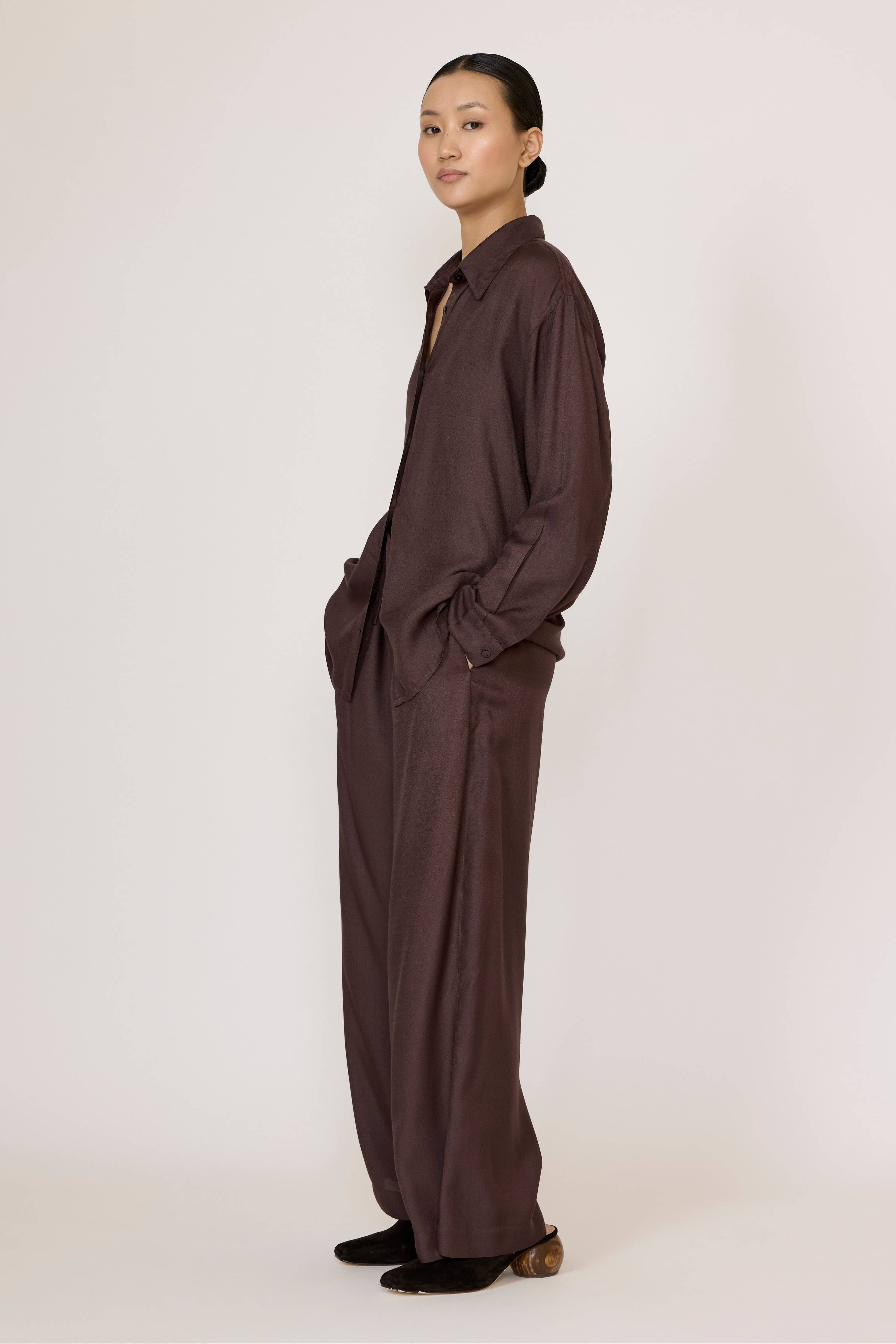 LAUDE Everything Shirt in chocolate brown fabric, showing a close-up of the casual, long-sleeve design with a relaxed fit.