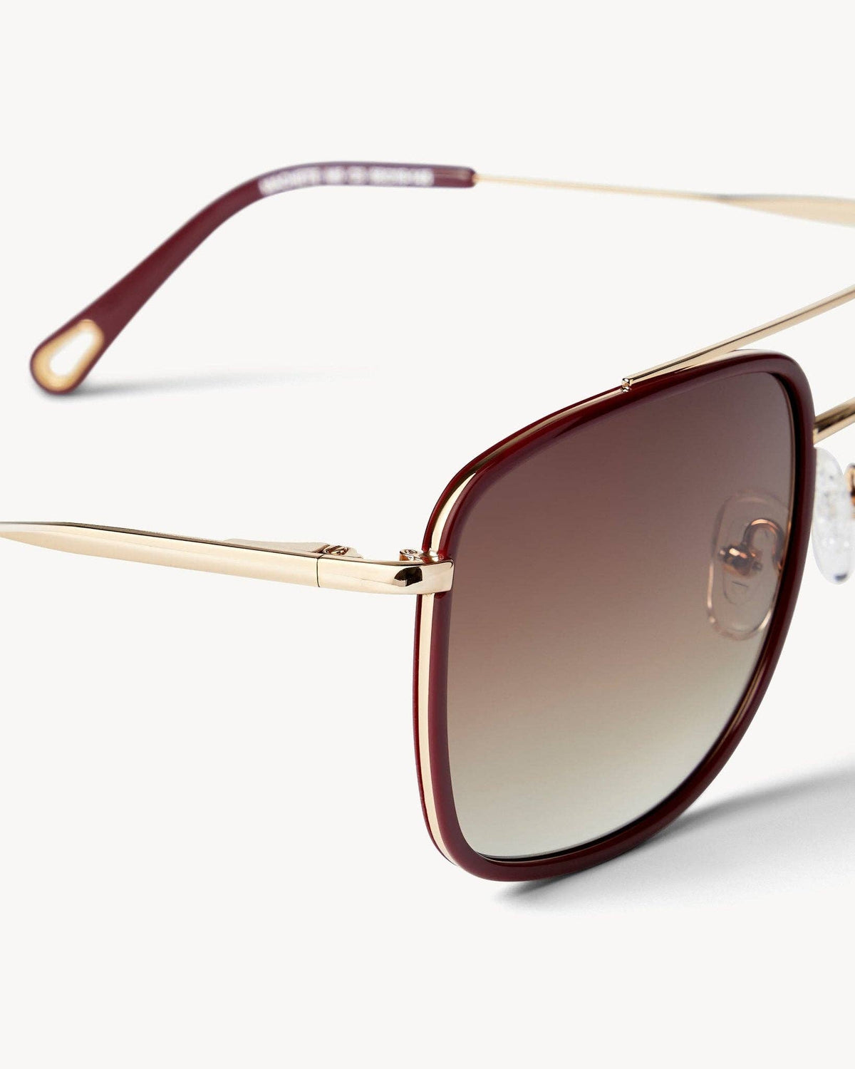 MACHETE Amelia sunglasses in oxblood with round frames and dark tinted lenses, stylish and fashionable eyewear.