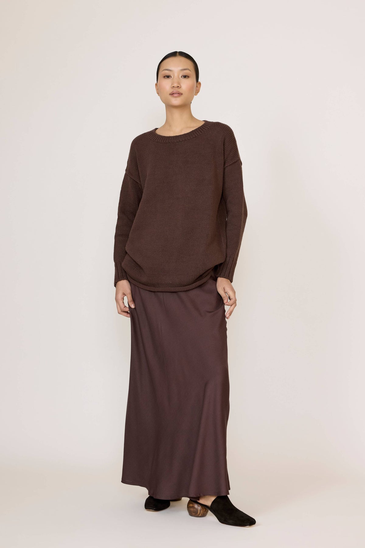 LAUDE oversized chocolate crewneck sweater displayed on a model, casual fit with ribbed cuffs and neckline for comfort.