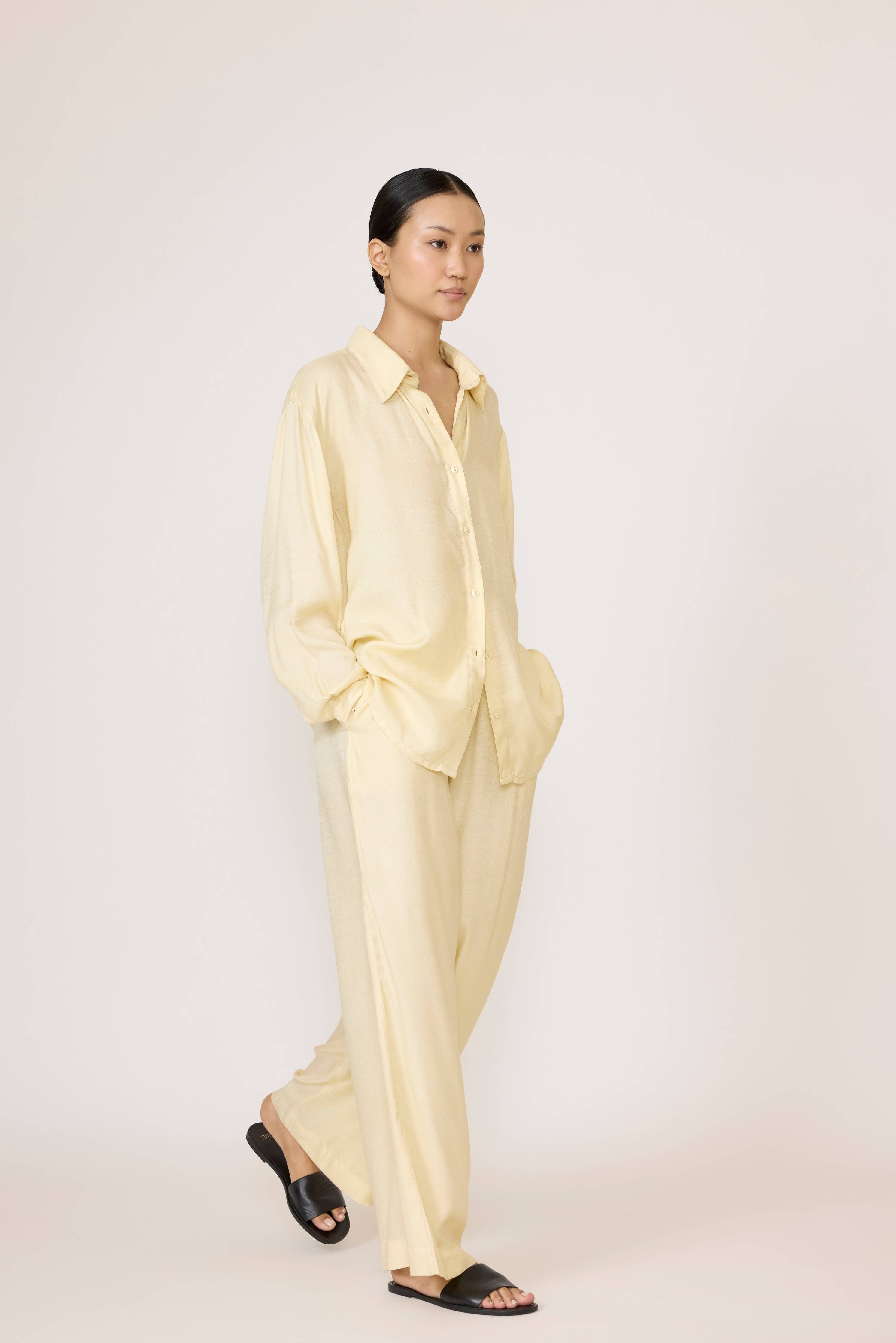 LAUDE Everything Shirt in Butter color, lightweight casual shirt with button front and relaxed fit, displayed flat.