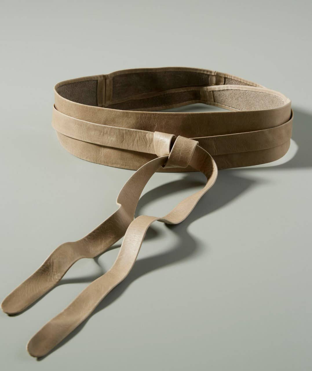 Leather wrap belt in mushroom color from ADA Collection Belts, showcasing the textured leather and stylish wrap design.