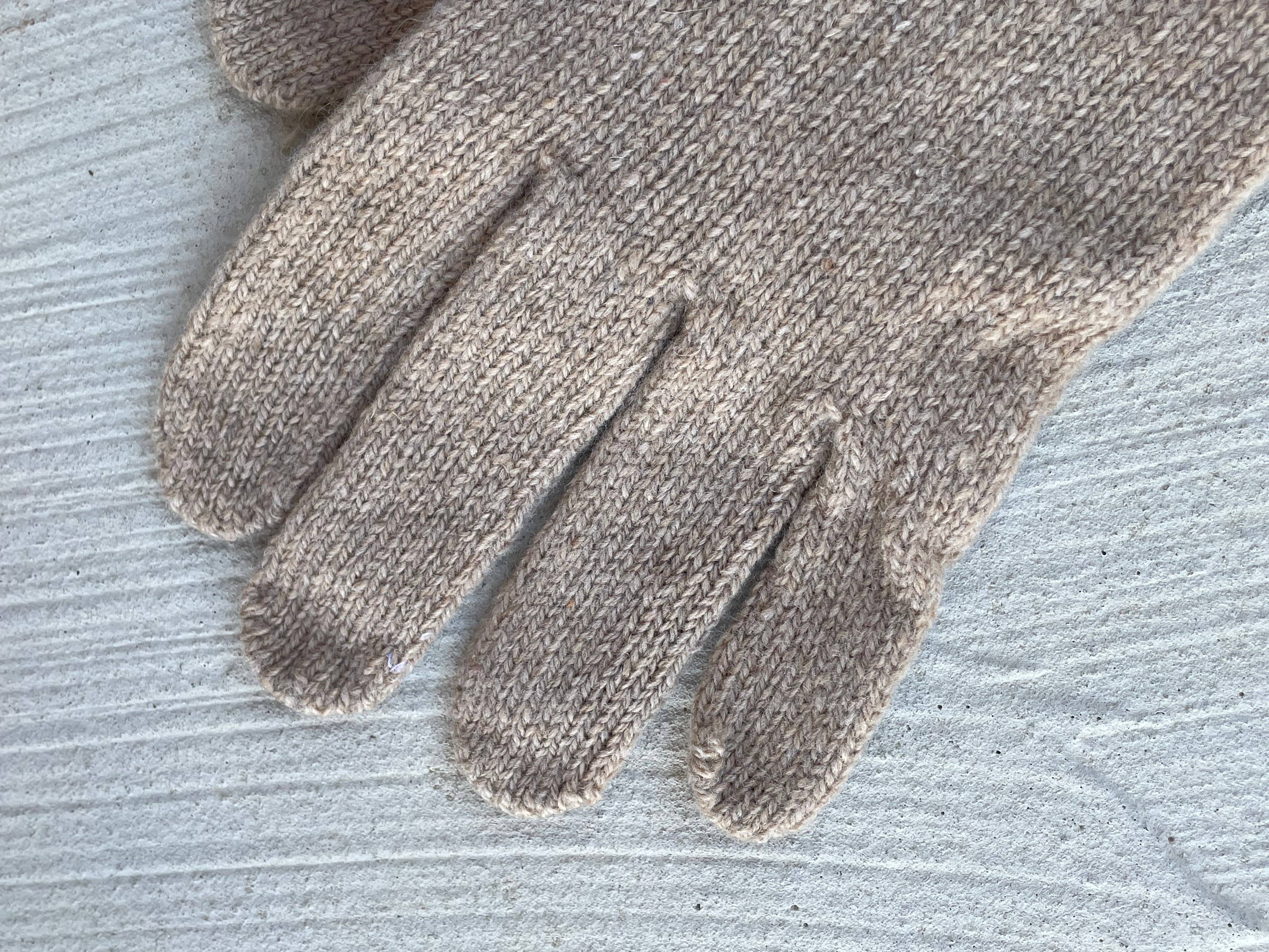 Camel Bedford recycled cashmere gloves by and for Good, shown laid flat with soft knit texture and ribbed cuffs.