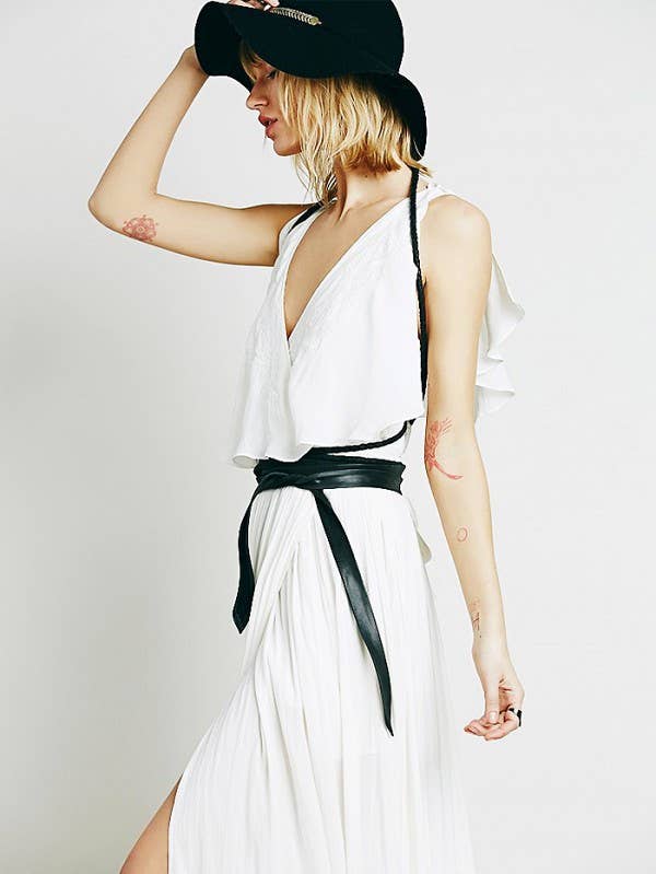 Black leather midi wrap belt from ADA Collection Belts, shown wrapped around a model's waist as a stylish accessory.