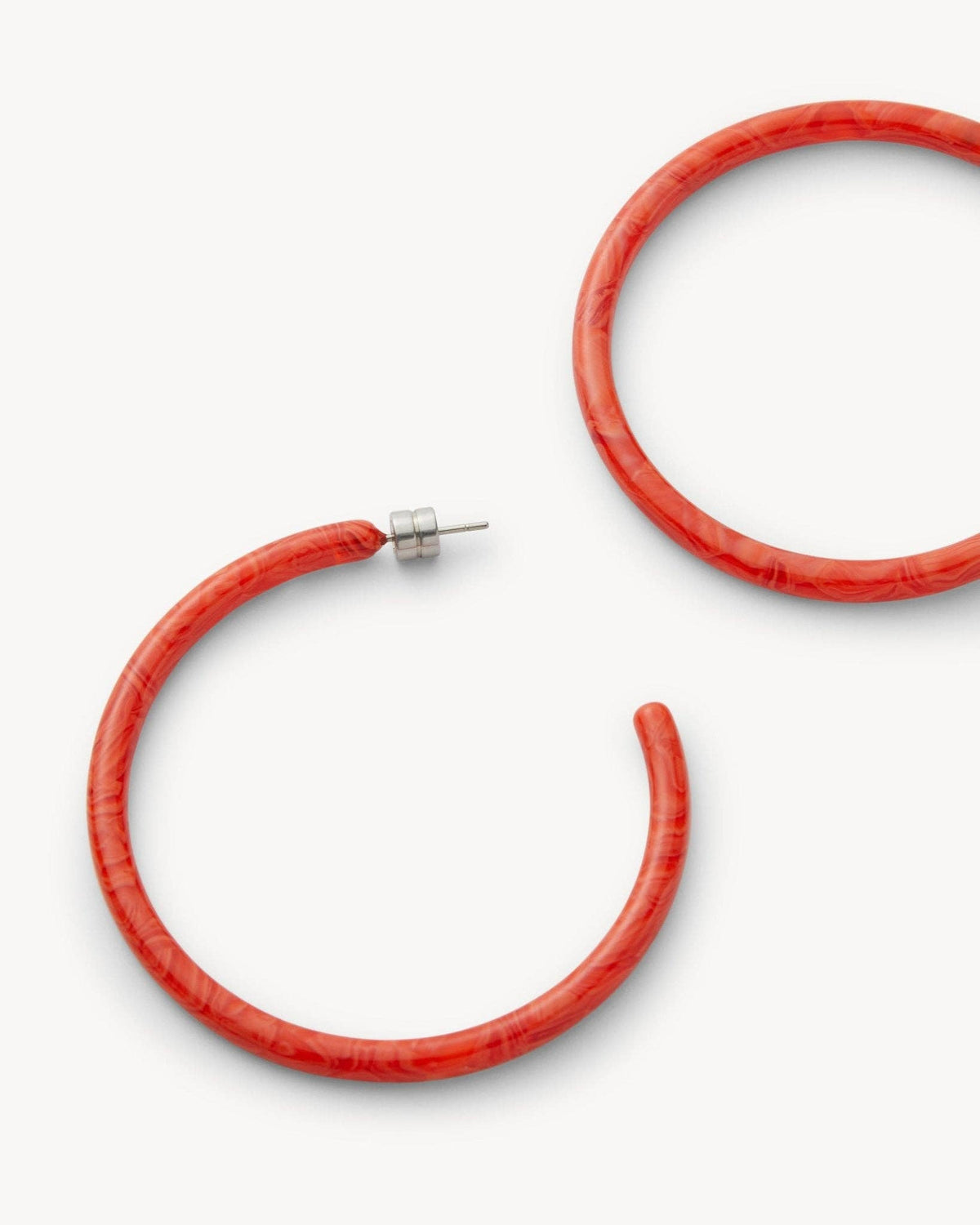 Large Poppy-colored hoop earrings by MACHETE featuring bold, circular design in vibrant orange for a statement accessory.