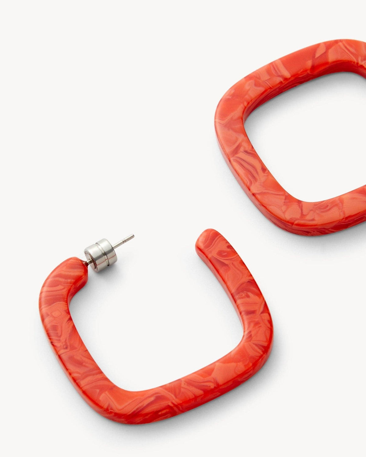 MACHETE Midi Square Hoops in Poppy, vibrant red square-shaped earrings with a sleek metal finish, hanging from pierced ears.