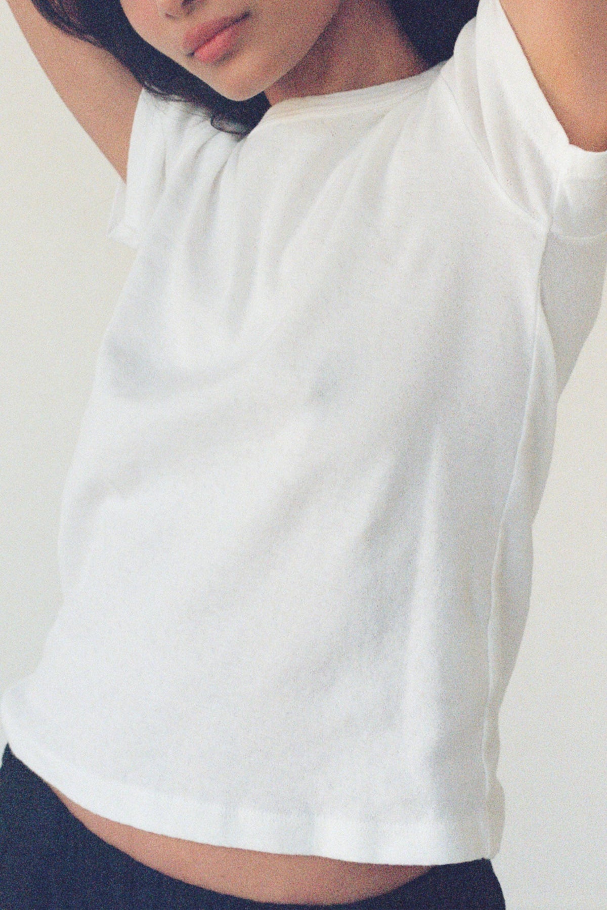 LA RELAXED Pointelle Baby Tee in soft knit fabric, featuring delicate openwork pattern and short sleeves for a comfortable fit.