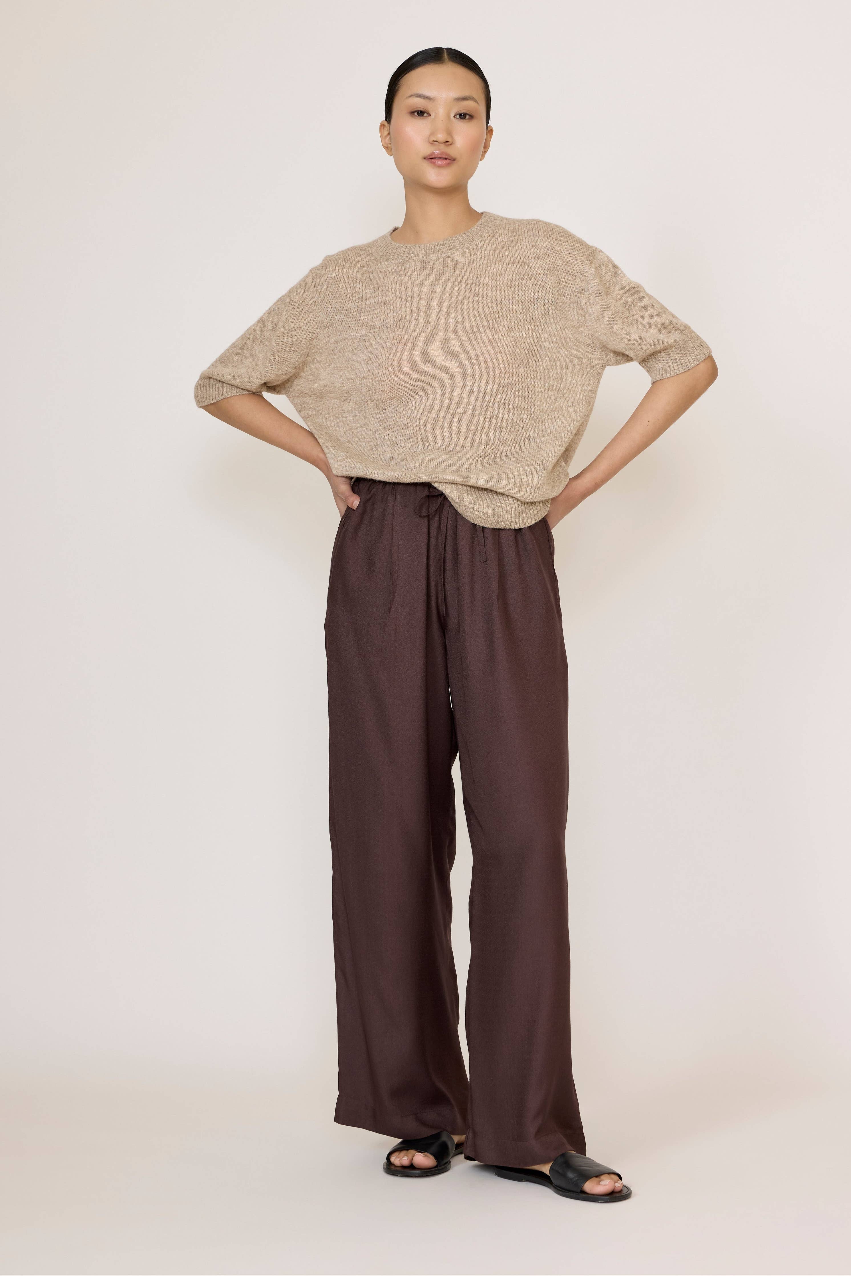 Chocolate brown Easy Pant by LAUDE, showcasing the relaxed fit and soft fabric details.